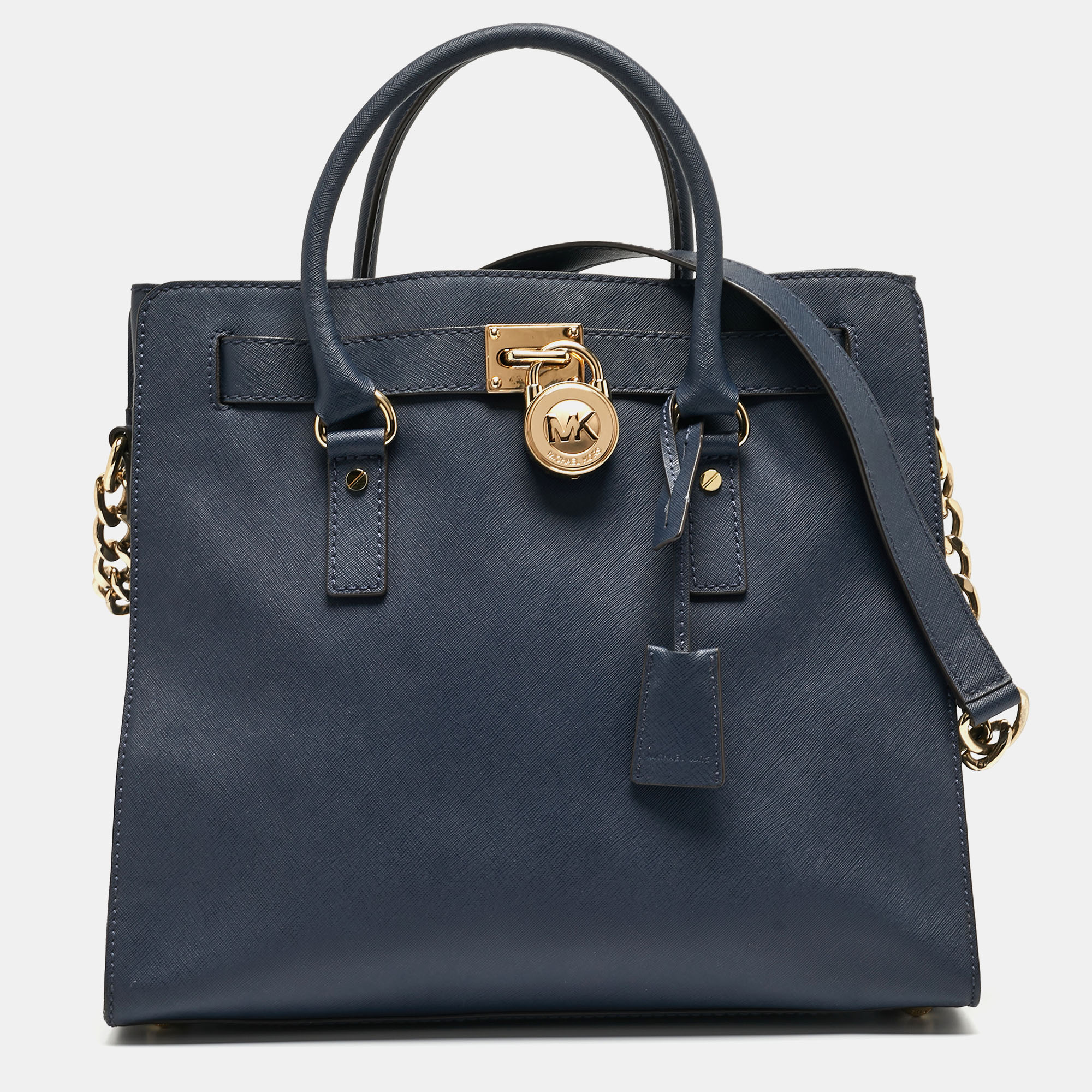 This MICHAEL Michael Kors tote promises to take you through the day with ease whether youre at work or out and about in the city. From its design to its structure the bag promises appeal and durability. It has two handles a shoulder strap and a spacious interior to hold all your essentials.