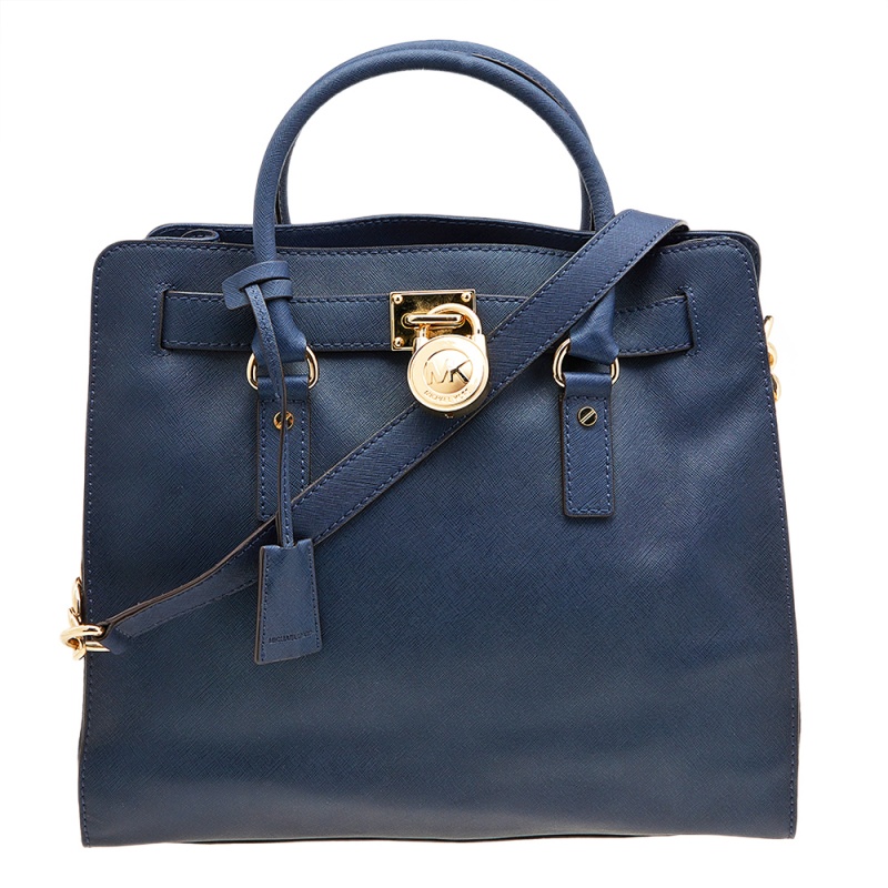 This Hamilton tote is from MICHAEL Michael Kors. It is crafted from Saffiano leather and decorated with an MK padlock at the front. The bag has two handles a shoulder strap and a spacious nylon interior. This creation is ideal for everyday use.