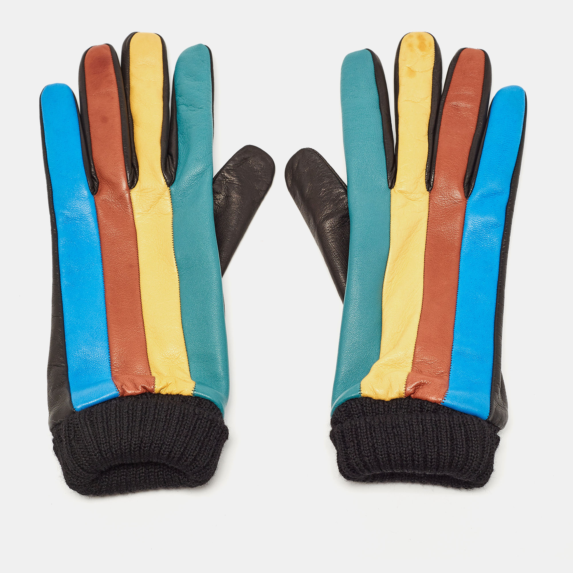 Crafted from supple leather the Missoni gloves are a fusion of luxury and style. Vivid hues converge in precise blocks adding a pop of color to winter ensembles. With a snug fit and exquisite craftsmanship they effortlessly blend fashion and function promising warmth without compromising on elegance.