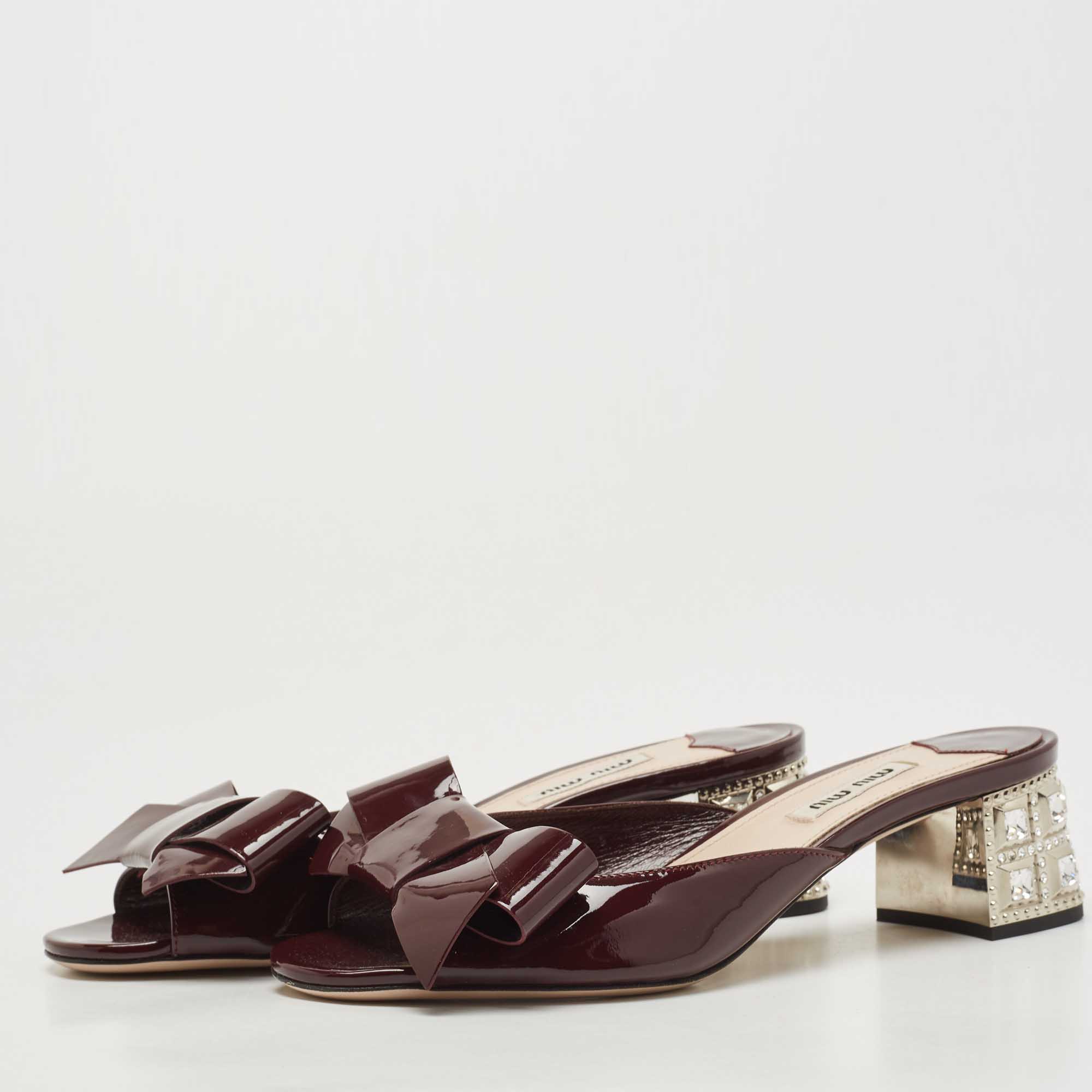 

Miu Miu Burgundy Patent Leather Bow Crystal Embellished Block Heel Slide Sandals Size