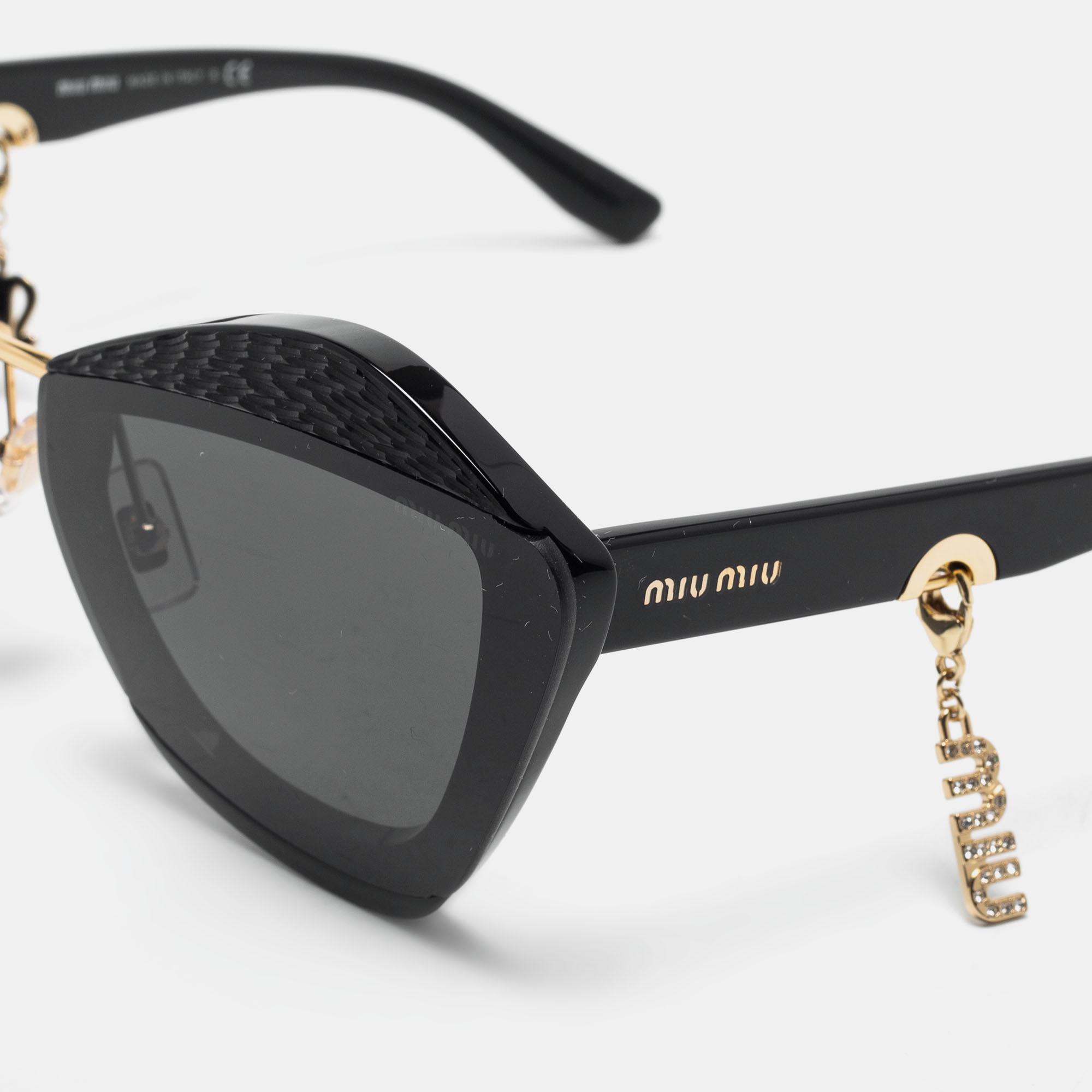 

Miu Miu Black / Grey SMU 01X Charms Aviator Sunglasses