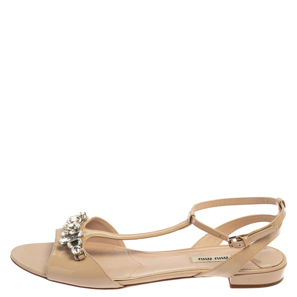 

Miu Miu Beige Crystal Embellished Patent Leather T Strap Flat Sandals Size