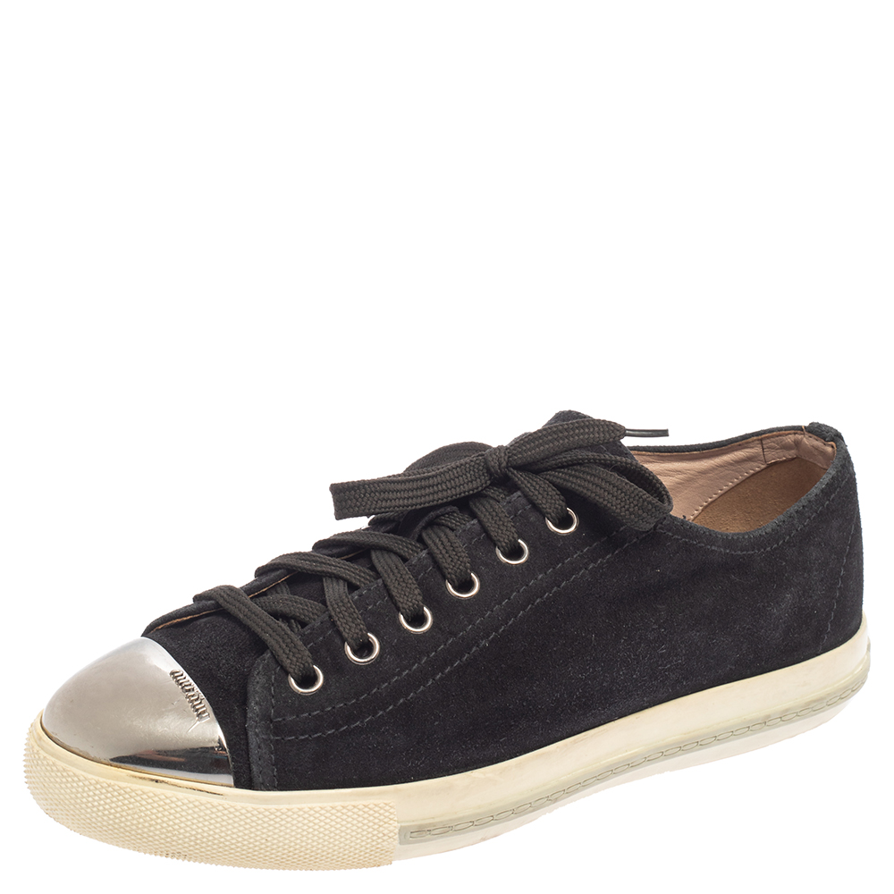 These sneakers from Miu Miu are a fine choice for everyday use The sneakers have been crafted from black suede and feature metal cap toes. They come equipped with comfortable leather lined insoles laced vamps and tough rubber soles.