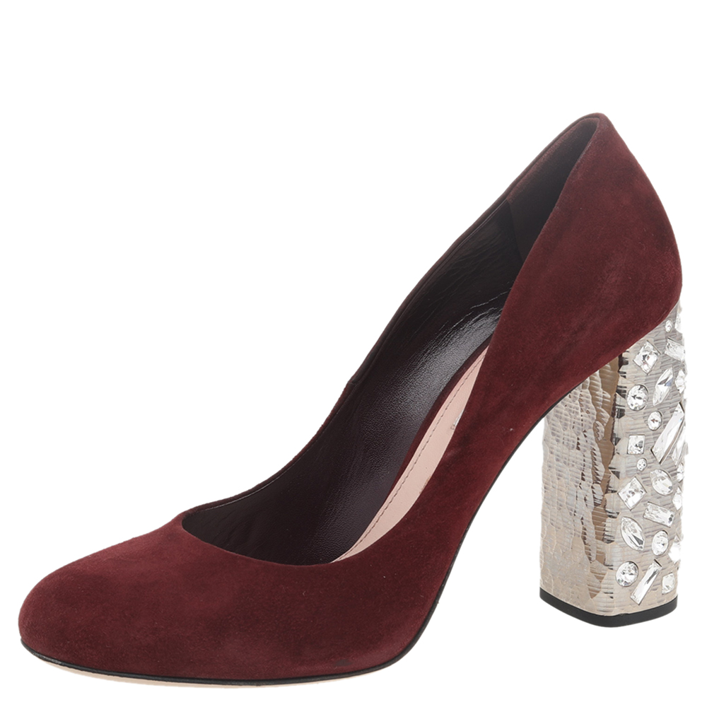 Miu Miu is well known for graceful designs and the label is synonymous with opulence femininity and elegance. Made using burgundy suede the pumps are made into a round toe silhouette. The crystal embellished block heels make them so versatile and easy to wear.