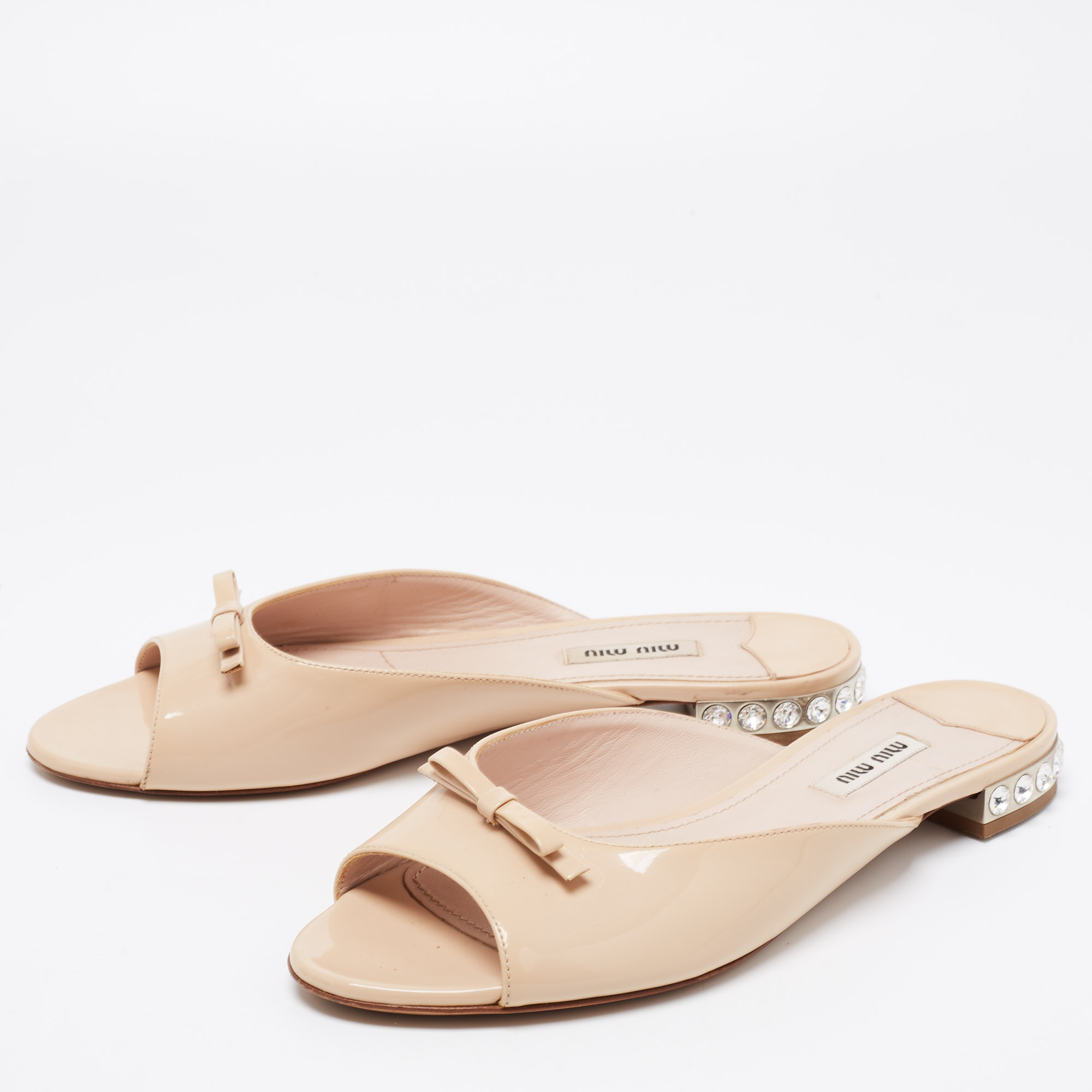 

Miu Miu Beige Patent Leather Bow Crystal Embellished Heel Flat Slides Size