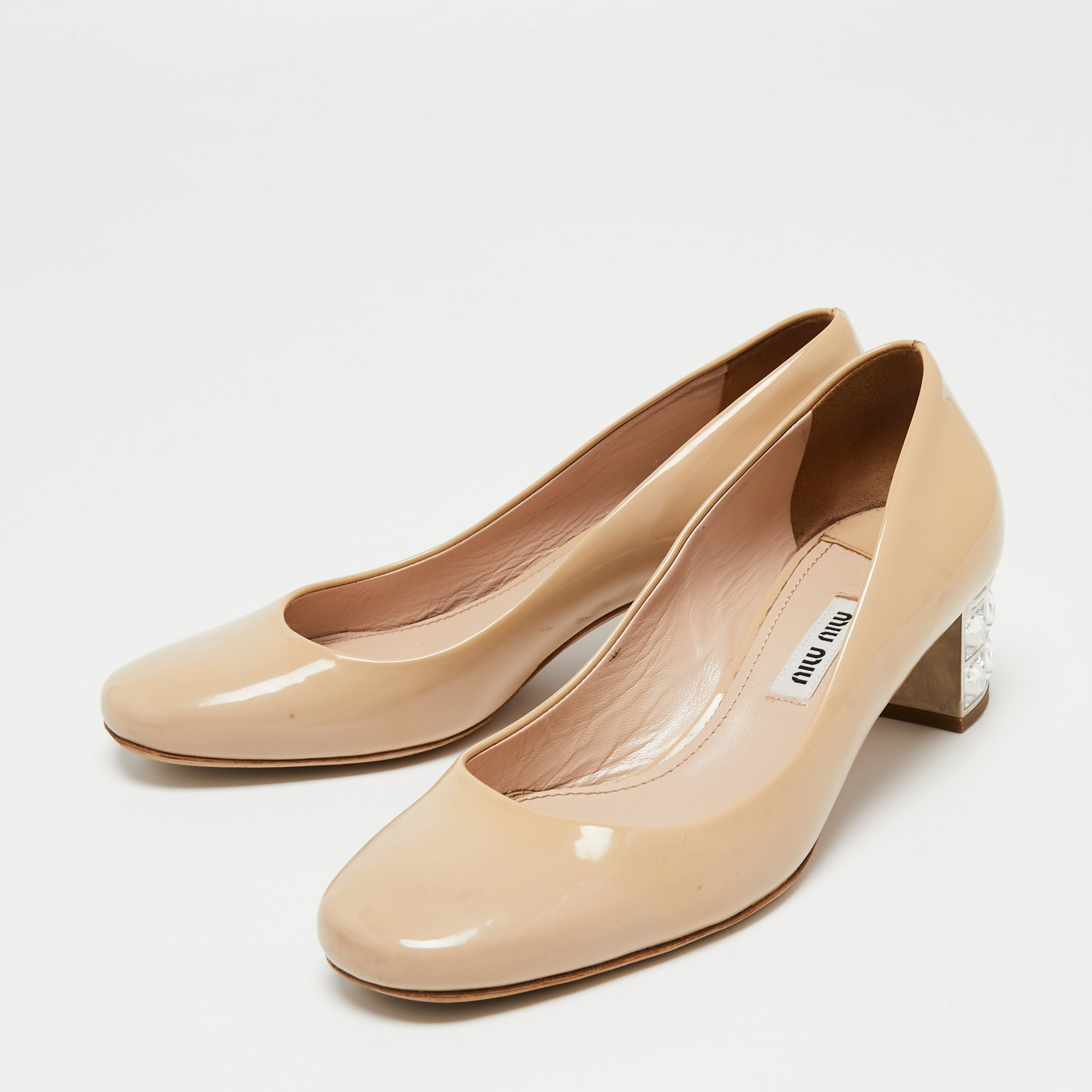 

Miu Miu Beige Patent Leather Crystal Embellished Block Heel Pumps Size