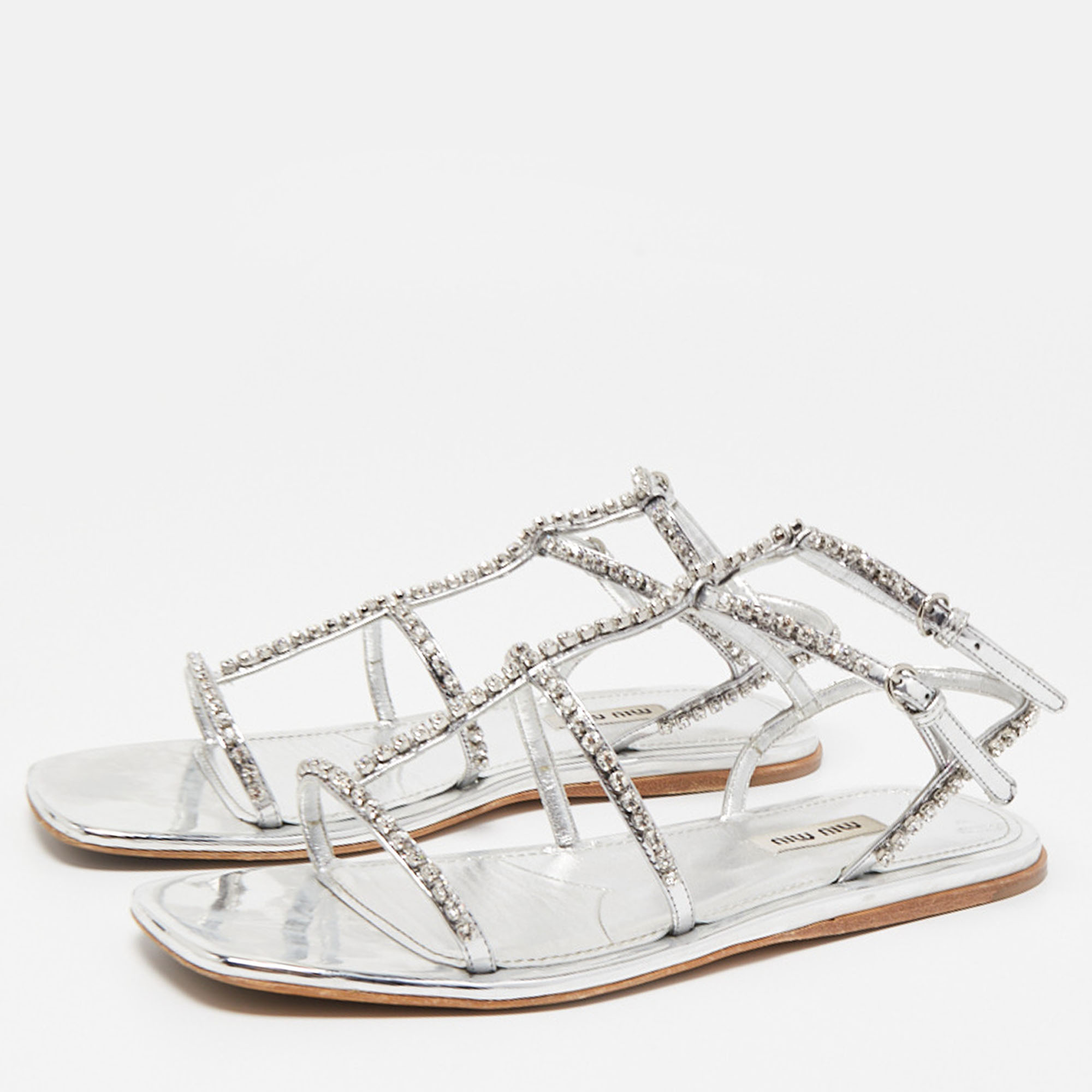 

Miu Miu Silver Leather Crystal Embellished Flat Sandals Size