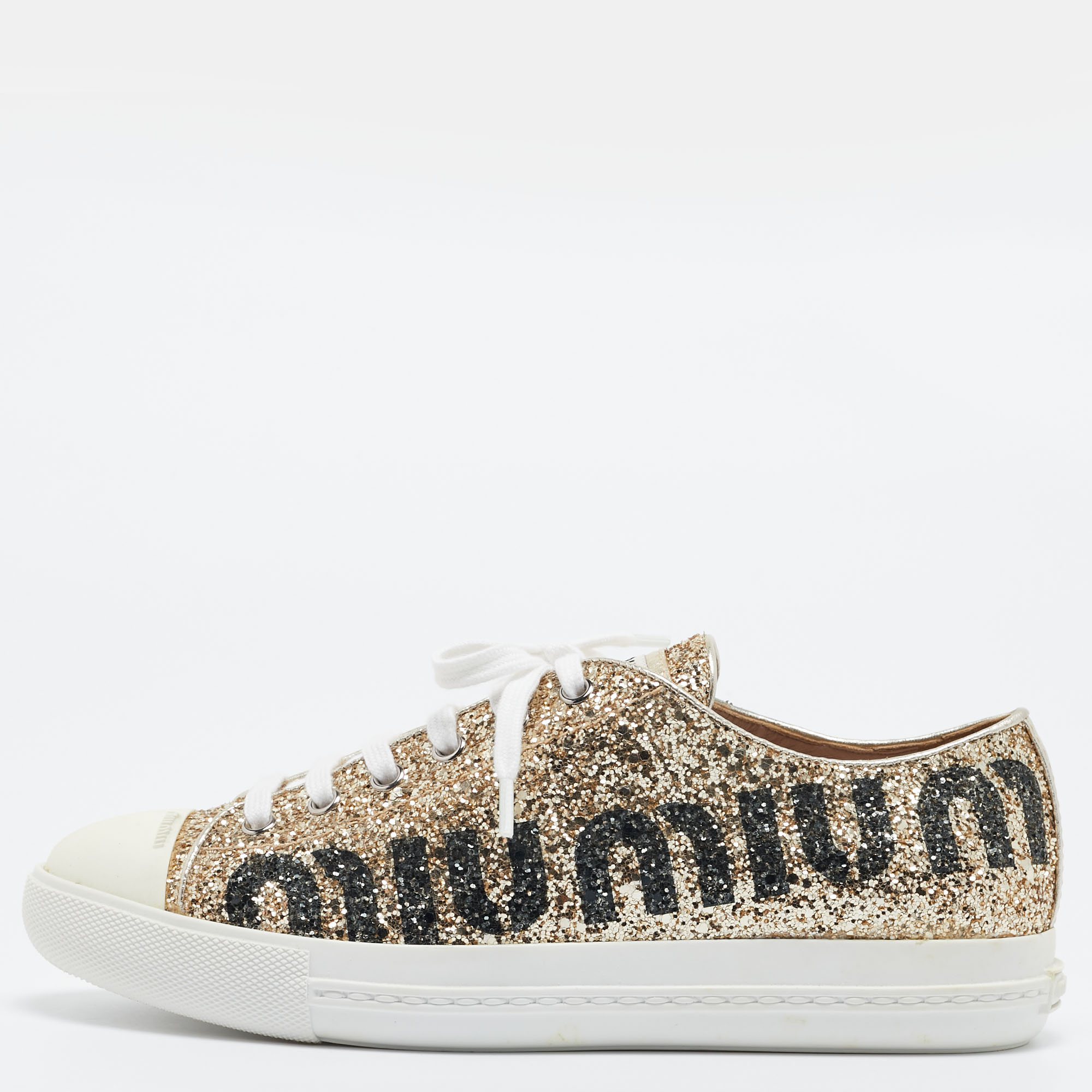 Presented in a classic silhouette these Miu Miu gold sneakers are a seamless combination of luxury comfort and style. These sneakers are designed with signature details and comfortable insoles.