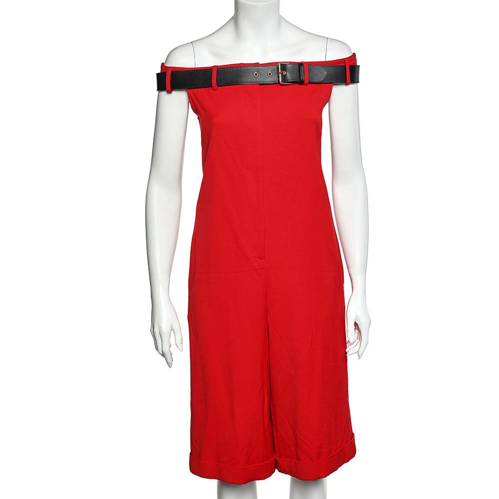 This pantsuit from the House of Moschino is an attractive creation that will sway you off your feet. It is fashioned in red wool fabric into an off shoulder silhouette. It is embellished with a belted detail and comes with a zip type closure and two external pockets. Look gorgeous as you wear this playsuit.