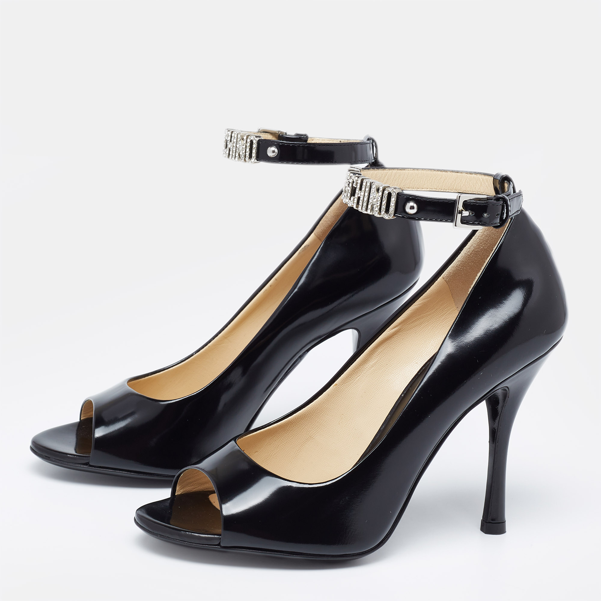 

Moschino Black Leather Logo Embellished Open Toe Ankle Strap Pumps Size