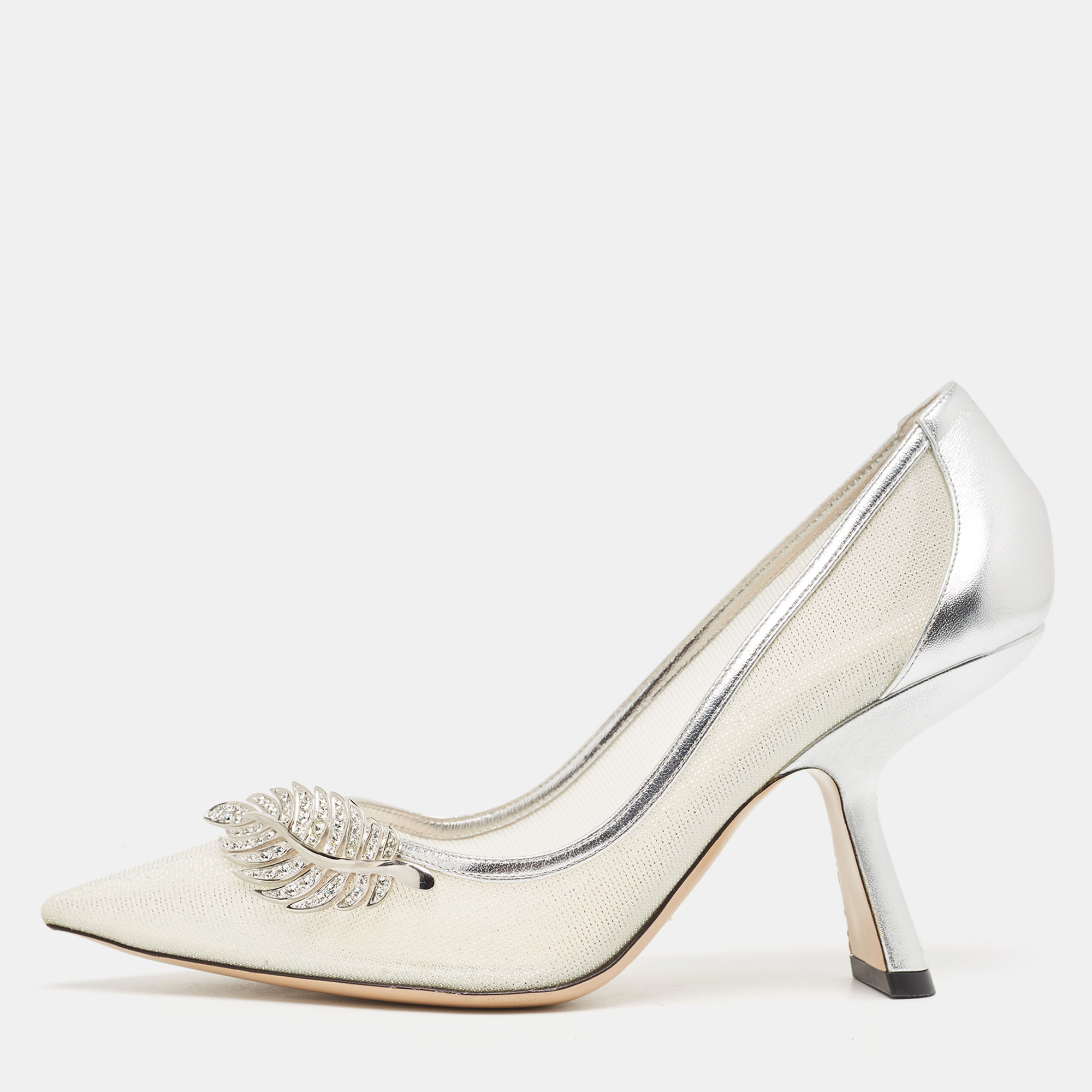 These pumps hail from Nicholas Kirkwood and are great for special occasions. Crafted from leather they come in a lovely shade of silver. They carry pointed toes crystal embellished uppers silver tone hardware and 9.5 cm heels. They are finished with leather soles.