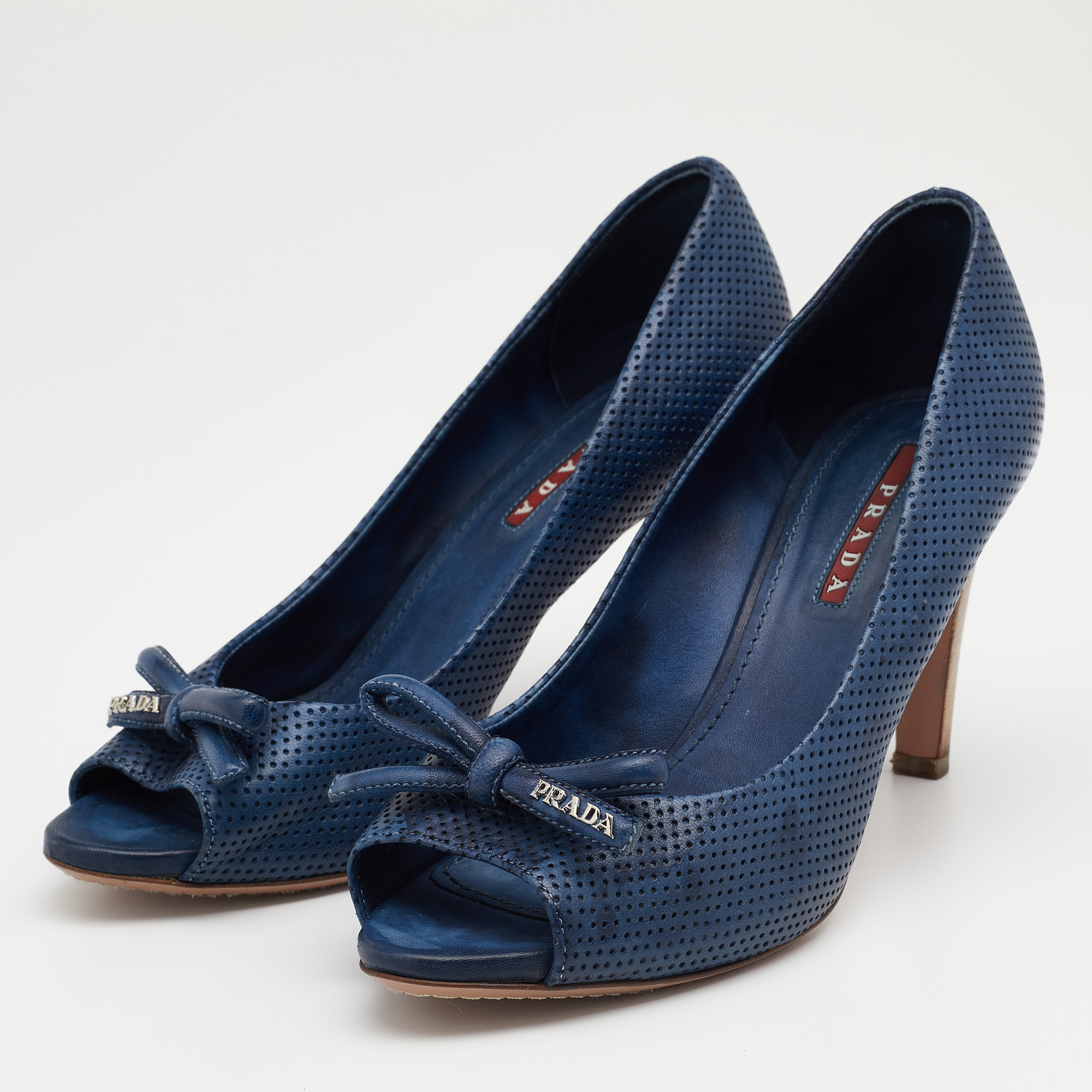 

Prada Sport Blue Perforated Leather Bow Peep Toe Pumps Size