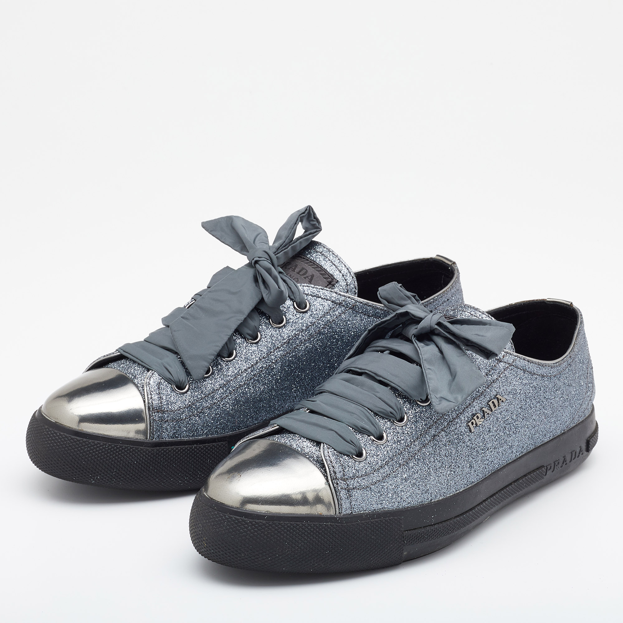 

Prada Sport Silver Glitter and Leather Cap Toe Low Top Sneakers Size