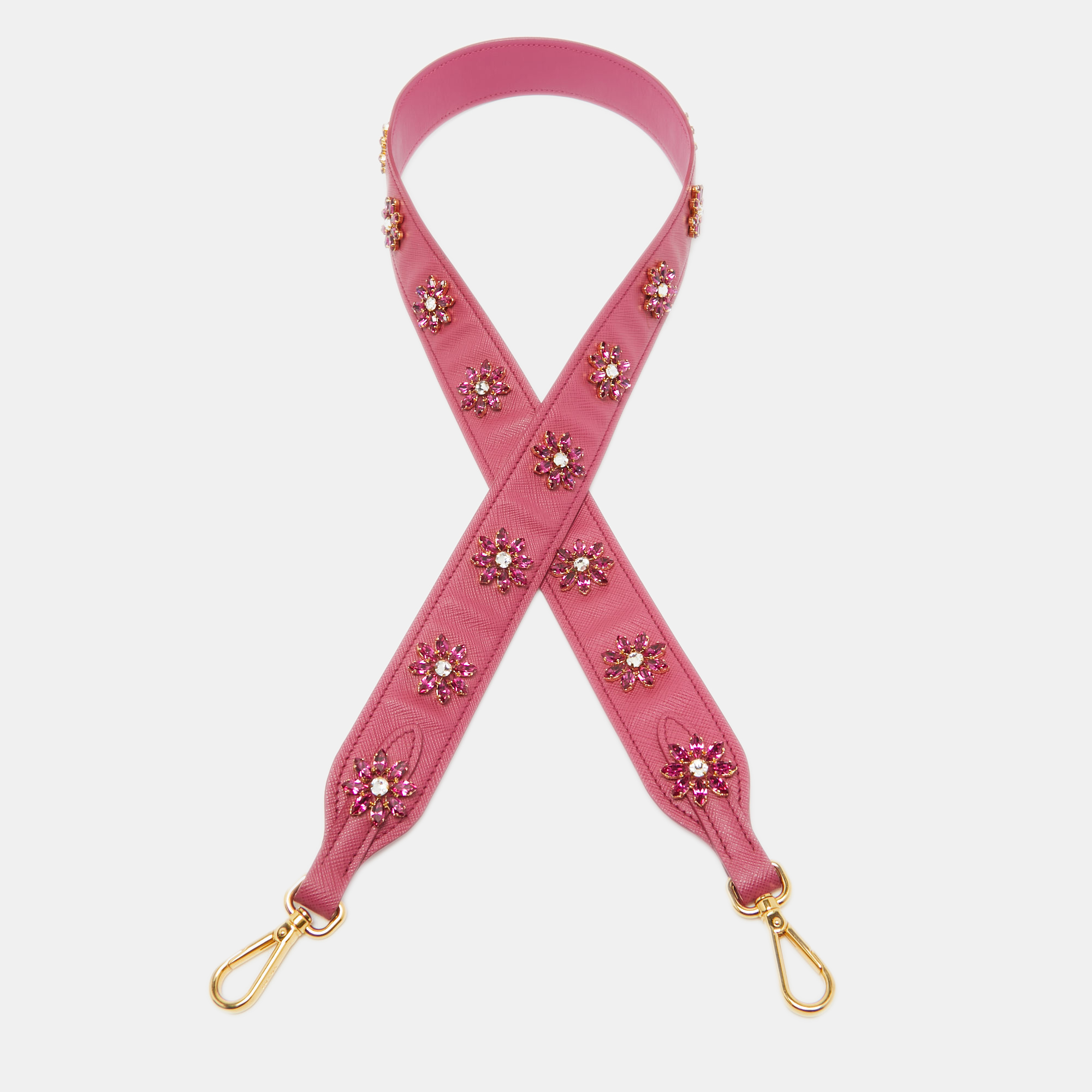 This functional bag strap hails from the house of Prada. It has been crafted from quality leather and comes in a bright pink hue with crystals granting a luxe look.