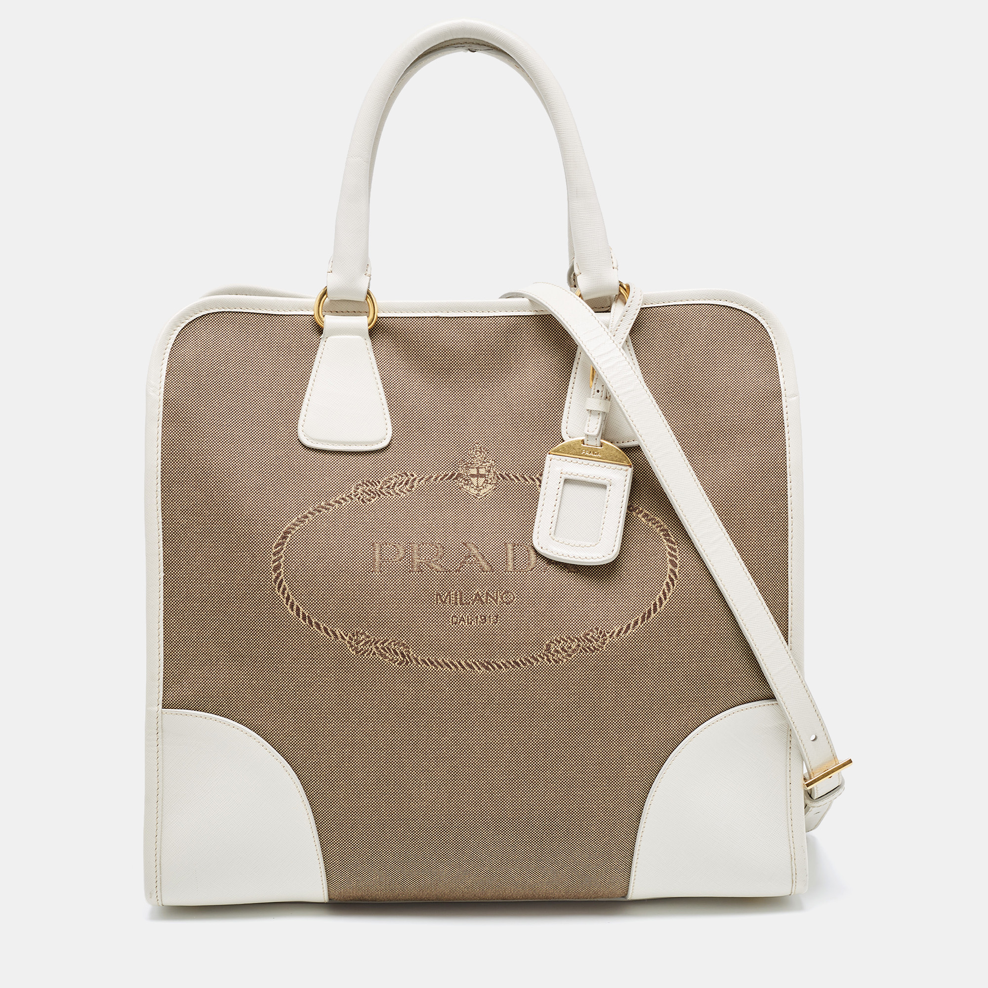 The simple silhouette and the use of durable materials for the exterior bring out the appeal of this designer tote for women. It features comfortable handles and a well lined interior.