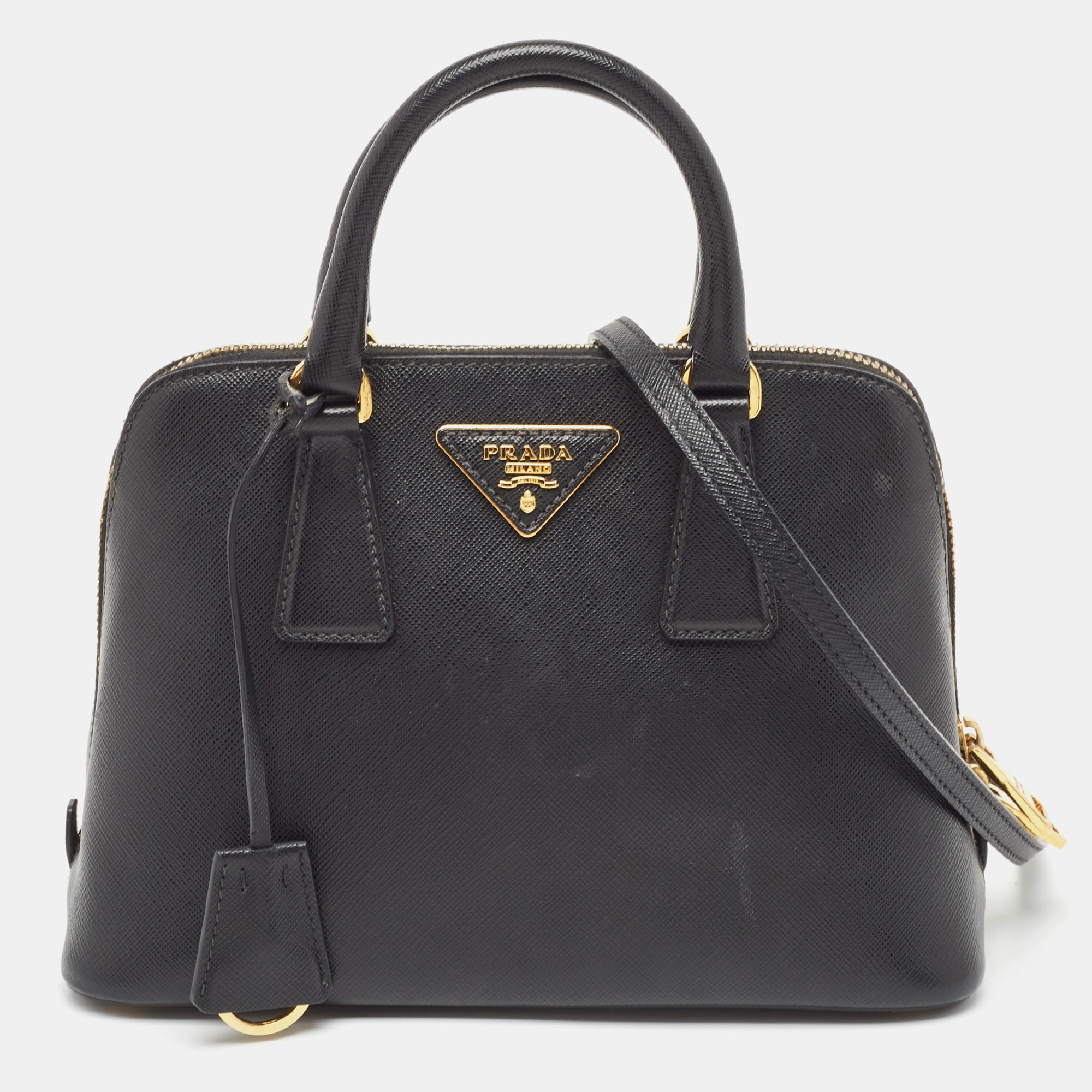 The simple silhouette and the use of durable materials for the exterior bring out the appeal of this Prada satchel for women. It features comfortable handles and a well lined interior.
