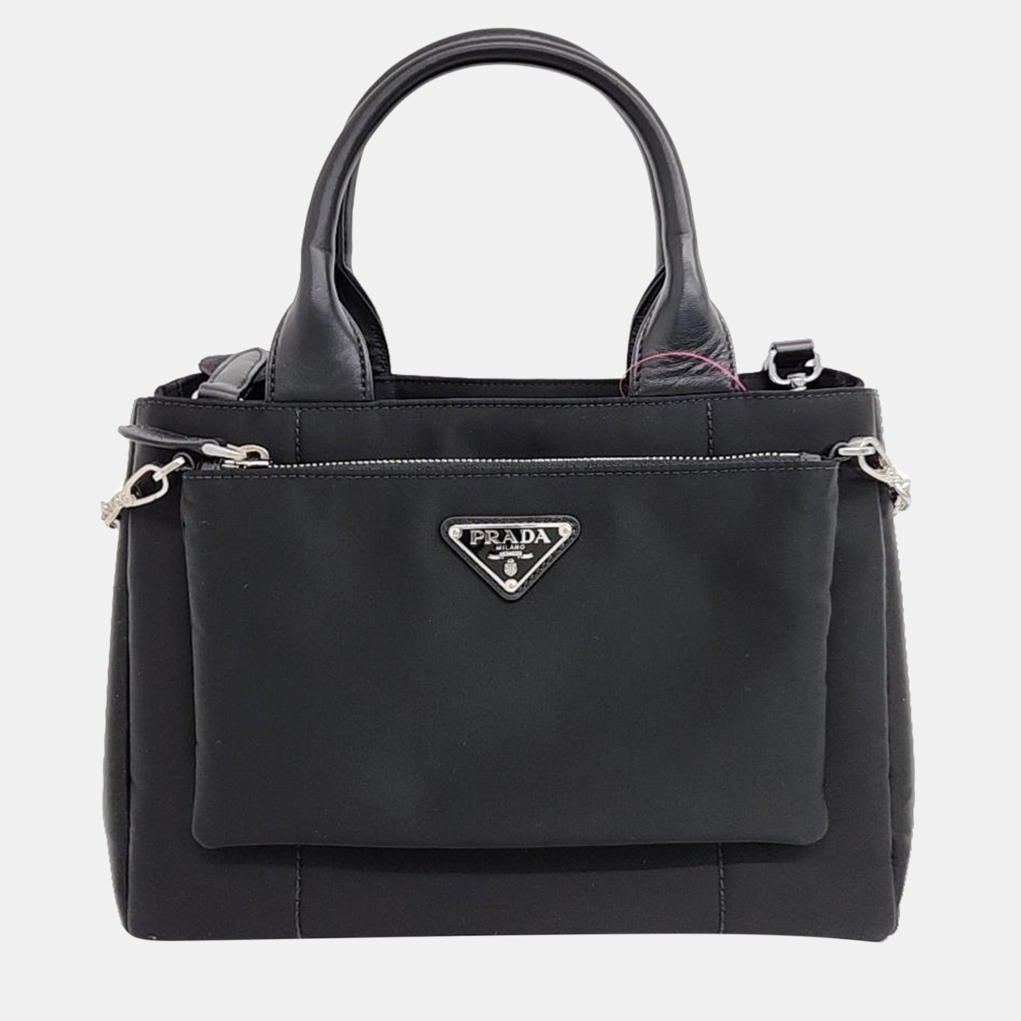 Crafted with precision this Prada shoulder bag combines luxurious materials with impeccable design ensuring you make a sophisticated statement wherever you go. Invest in it today.
