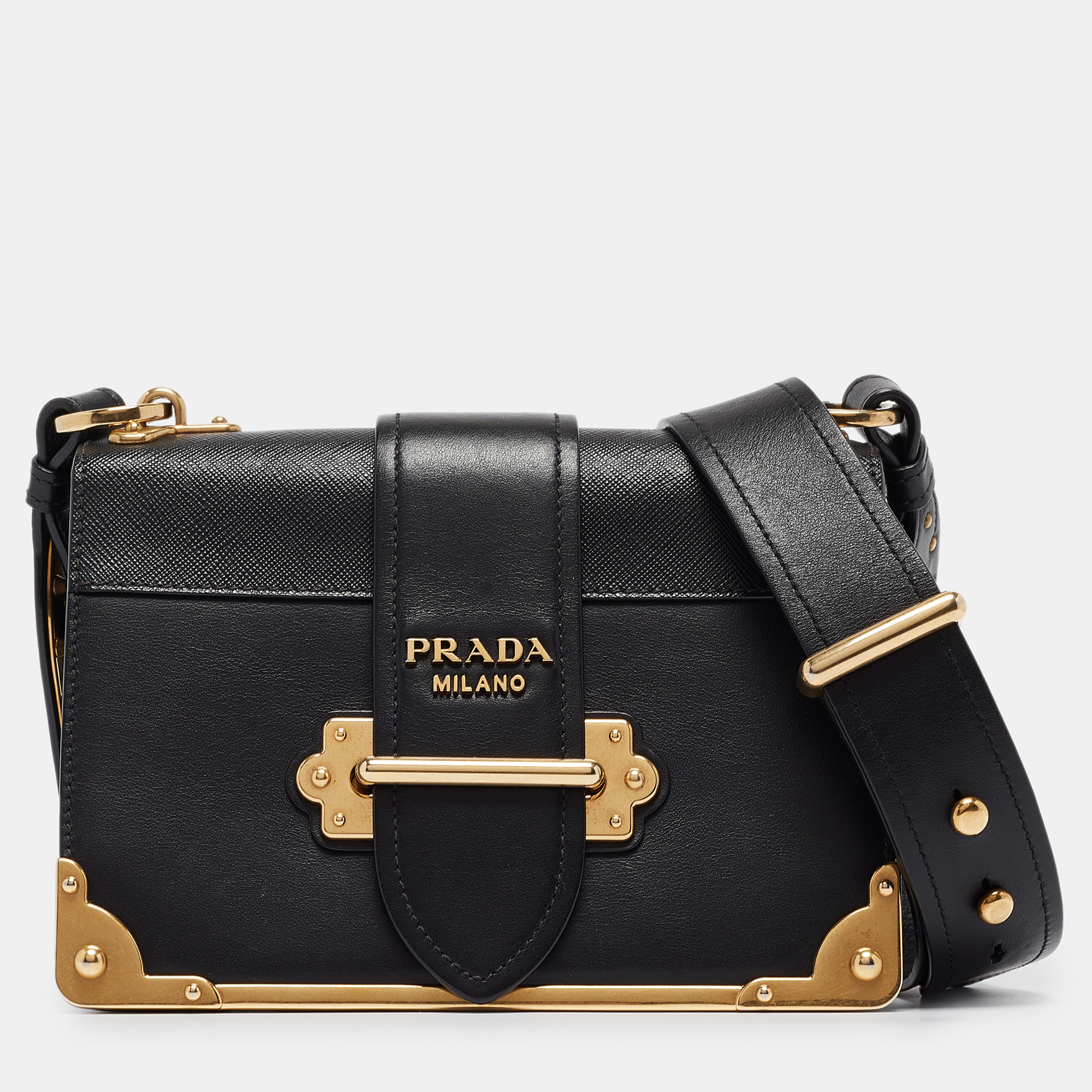 Impeccably designed in Lux leather this Cahier bag by Prada is the perfect one for the modern fashionista. Lined with fine leather this black hued bag delivers trendy looks as well as functionality. It is adorned with gold tone accents and a tuck in strap closure. The long shoulder strap enhances its functionality.