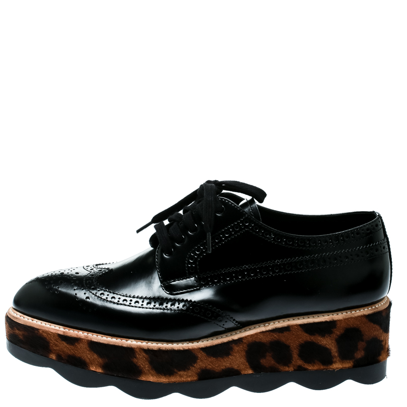 

Prada Black Brogue Leather And Leopard Print Calf Hair Platform Derby Size