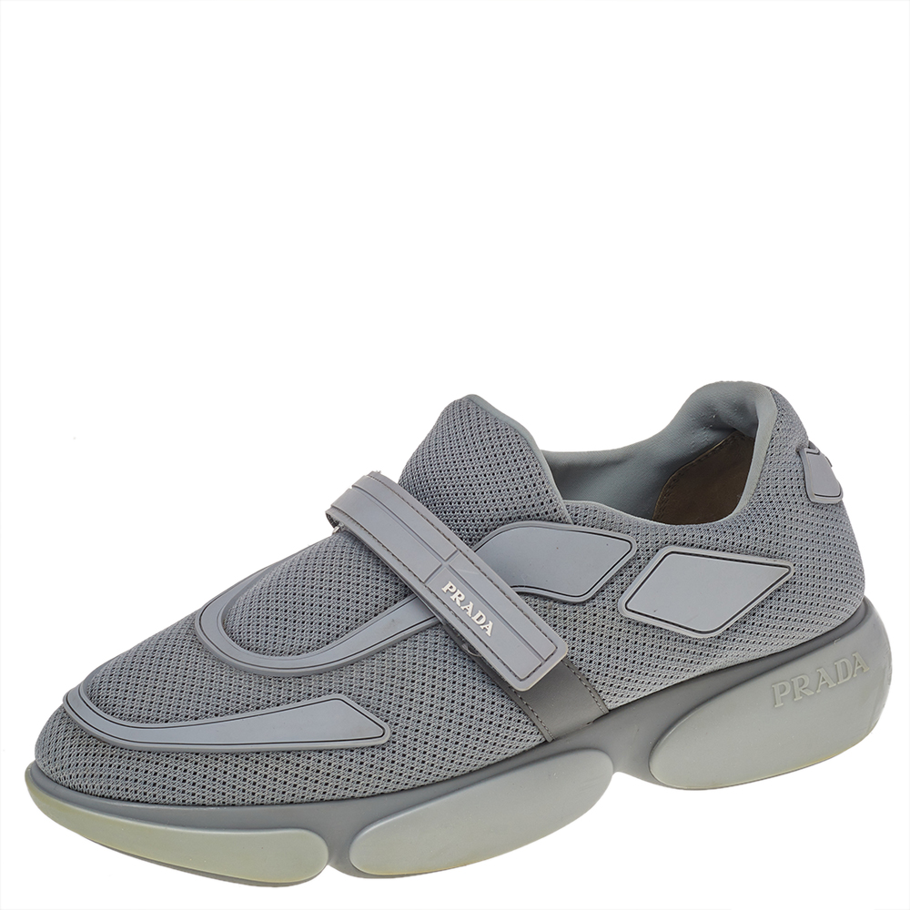 Bringing both ease and fashion in full are these Prada Cloudbust Slip On sneakers. They feature a mesh fabric body enhanced with leather trims and fastened with velcro straps. Wear them on long days for a great style without compromising on the comfort factor.