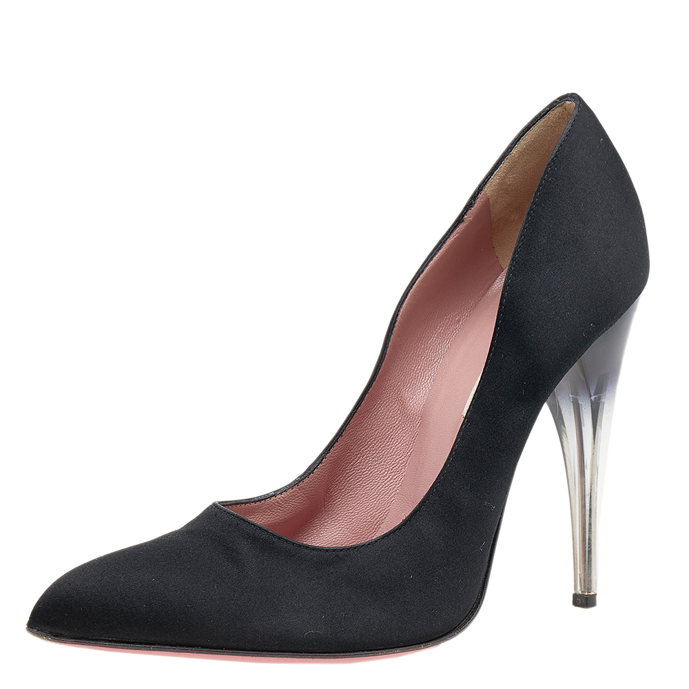 There are some shoes that stand the test of time and fashion cycles these timeless Prada pumps are the one. Crafted from satin in a black shade they are designed with sleek cuts pointed toes and tall heels.