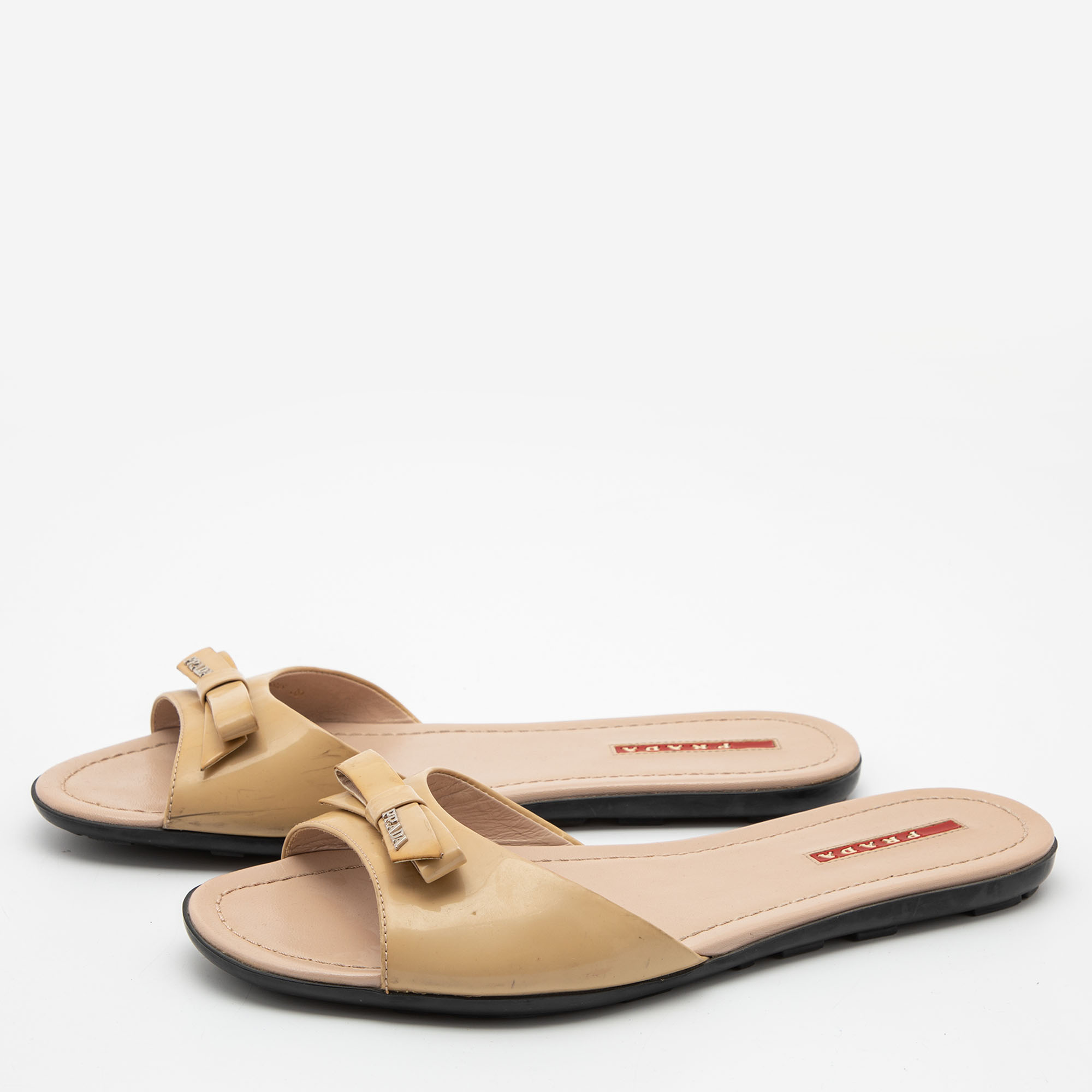

Prada Beige Patent Bow Flat Sandals Size