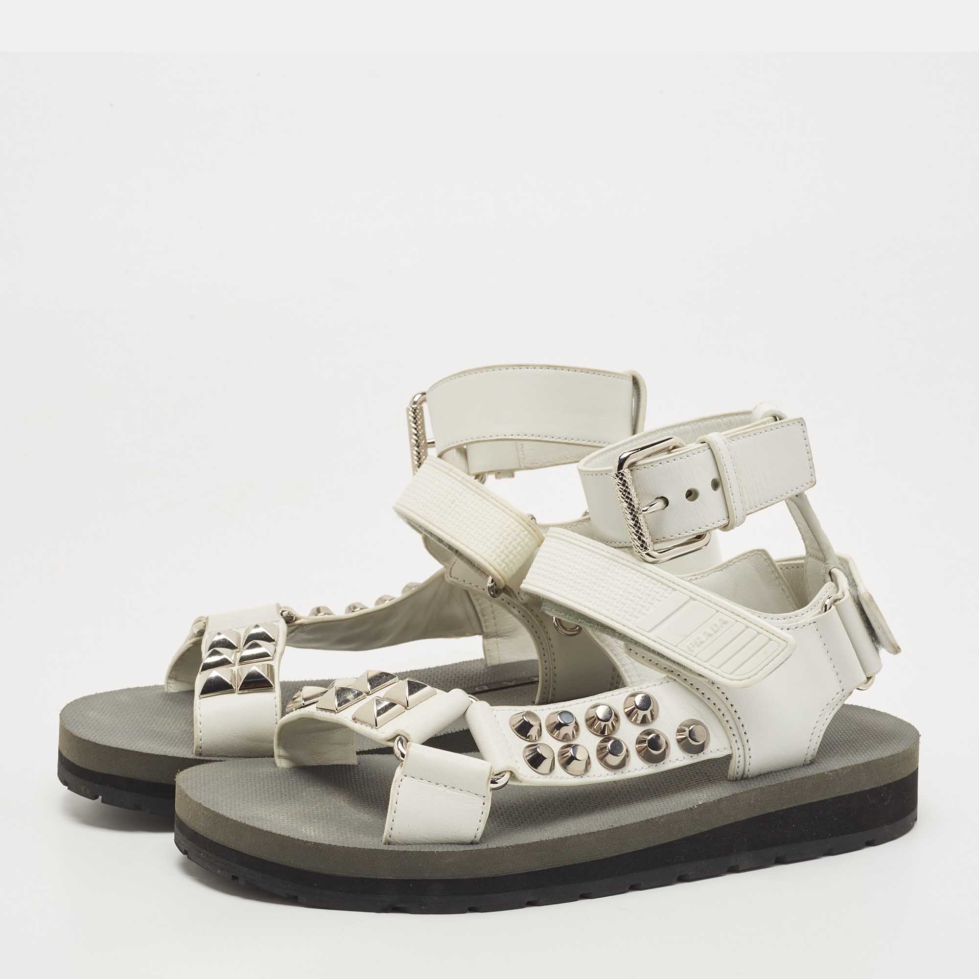 

Prada White Leather Stud Embellished Ankle Strap Flat Sandal Size
