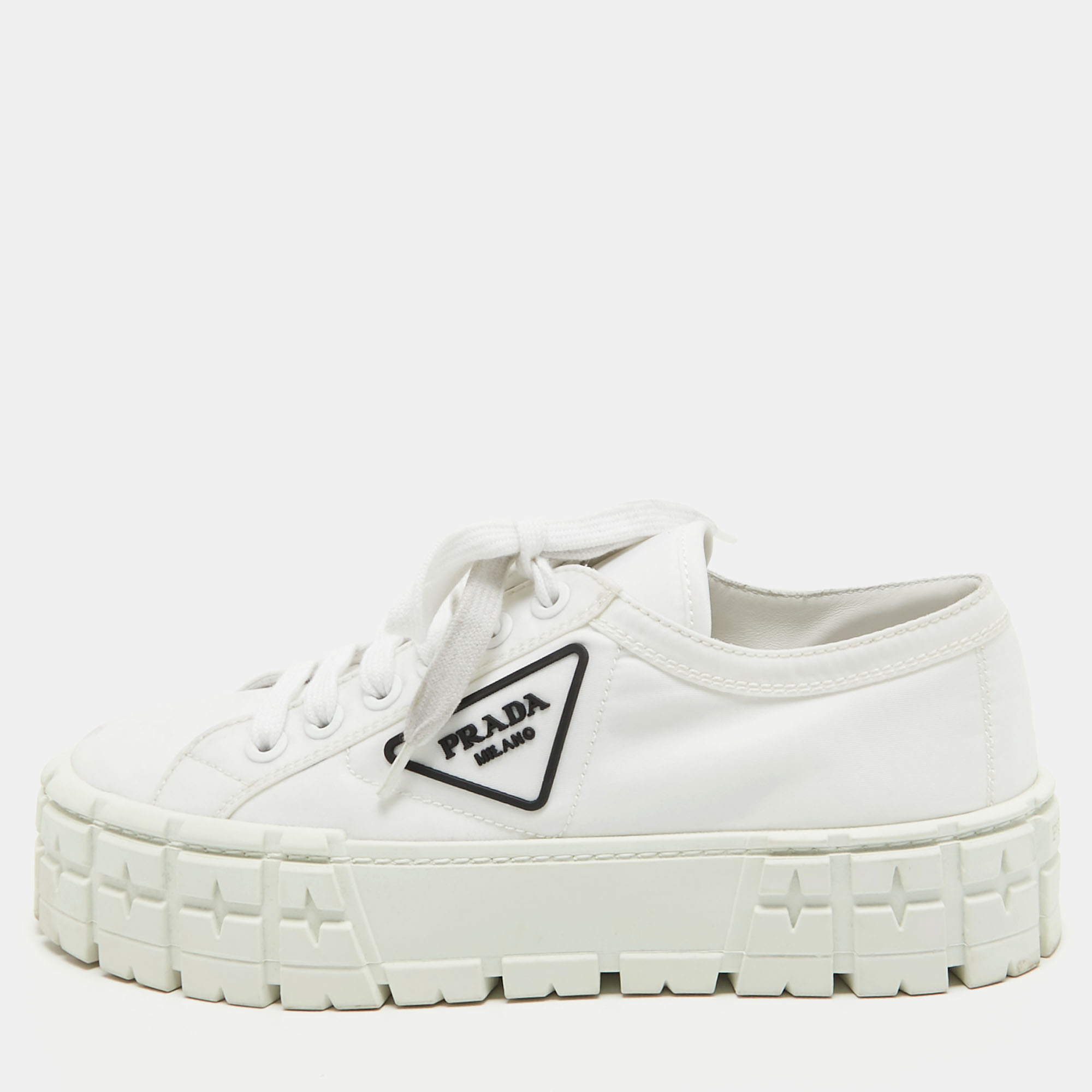 Step into fashion forward luxury with these Prada white sneakers. These premium kicks offer a harmonious blend of style and comfort perfect for those who demand sophistication in every step.