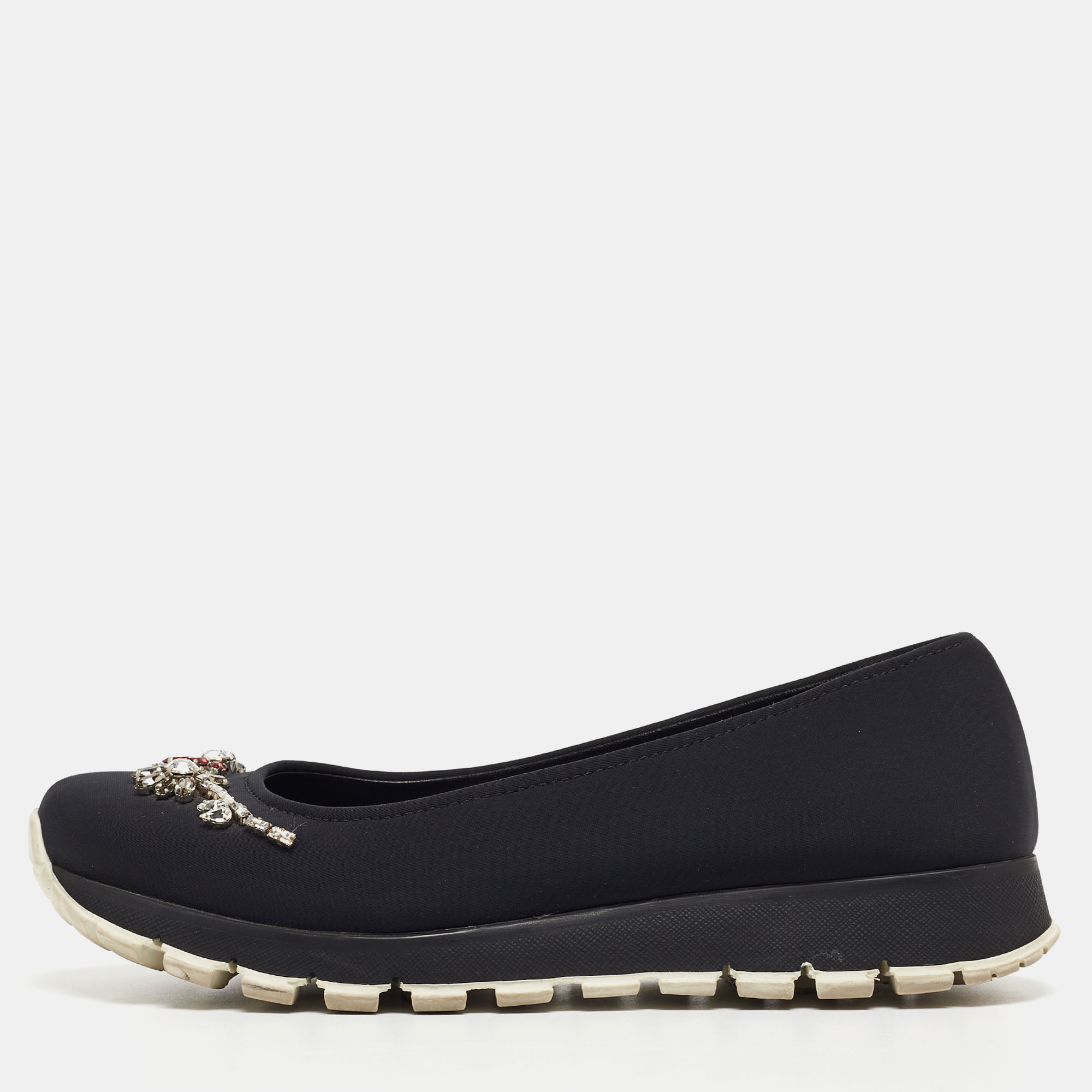 Beautifully crafted using neoprene these Prada slip on sneakers are sure to keep you comfortably stylish. Featuring crystals sturdy soles and leather insoles these shoes will be a great addition to your closet.