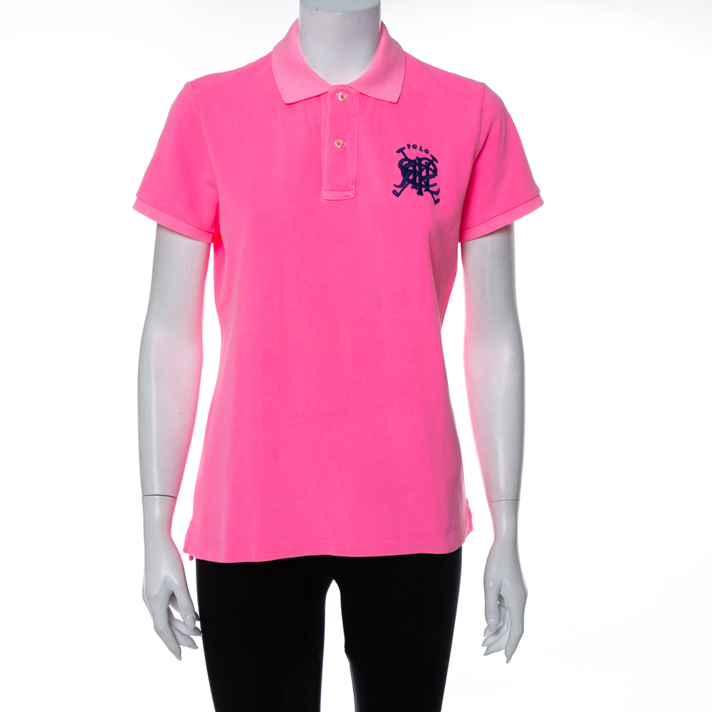 Ralph Laurens Polo T shirt for women ensures comfort with a simple yet luxe tone of style. It is made from cotton and designed with short sleeves front buttons a simple collar and embroidered motif on the front. The T shirt will work well with basic jeans skirts and shorts.