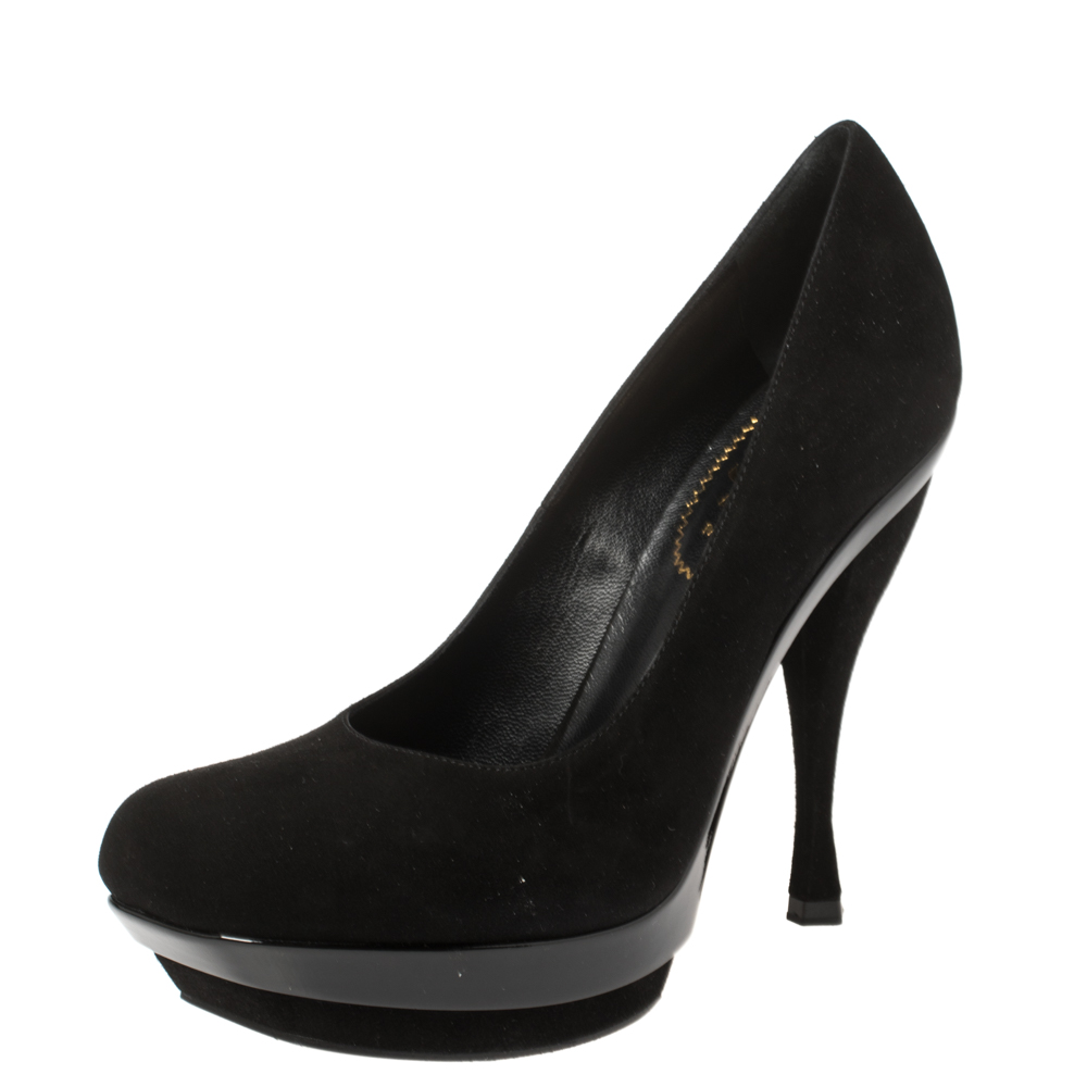 Designed with high stiletto heels and a classic black shade this pair of Saint Laurent peep toe pumps is perfect for your formal looks. They are made from suede and designed with platforms and 12.5 cm heels. Lined with leather they are a must have