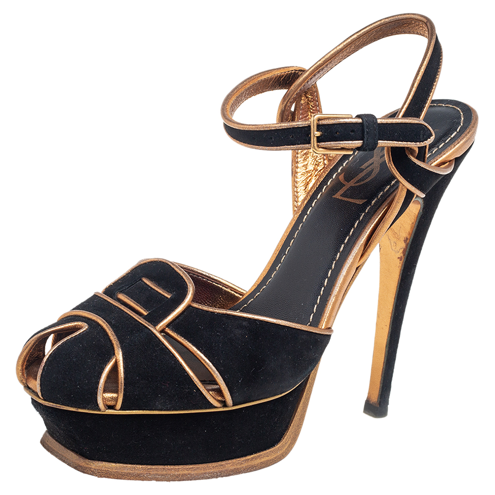 One of the most celebrated fashion houses the Parisian label Saint Laurent is known for its brilliant craftsmanship. The sandals are such a craze amongst fashionistas around the world and it is time you own one yourself. These black ones are designed with suede straps gold trims ankle fastenings and 14 cm heels supported by platforms.