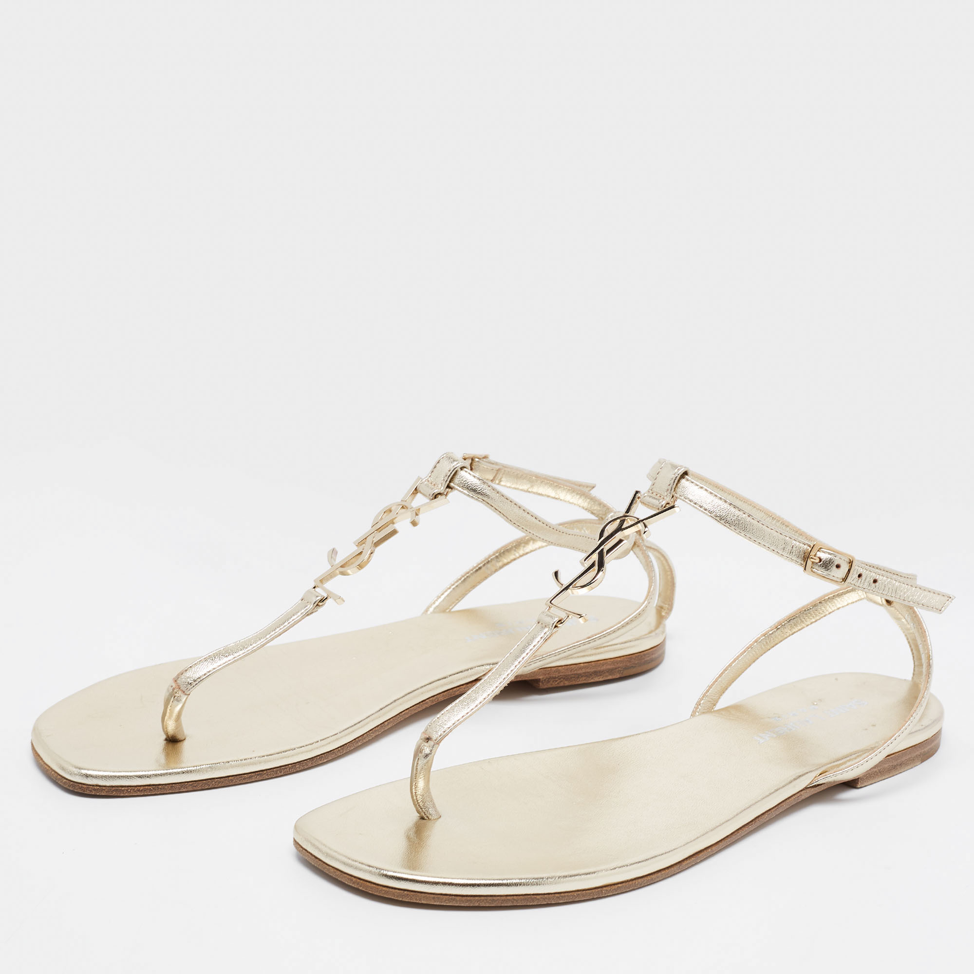 

Saint Laurent Gold Leather Cassandra Flat Ankle Strap Sandals Size