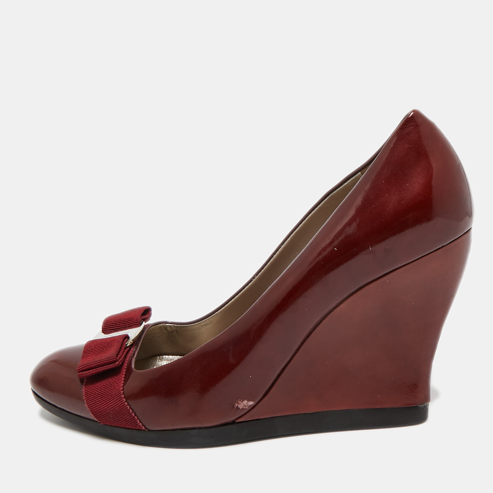 

Salvatore Ferragamo Burgundy Patent Leather Vara Bow Wedge Pumps Size 40