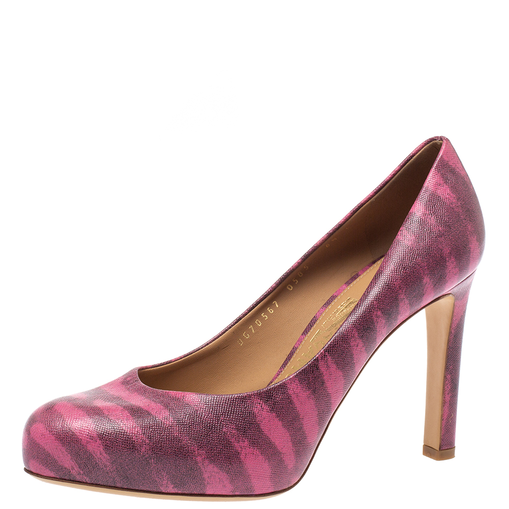 Smart and stylish these pink pumps from Salvatore Ferragamo will instantly add a dash of charm to your outfits. They are crafted from animal printed leather and styled with almond toes. They are elevated on 10 cm heels and will help you walk comfortably with their leather lined insoles.