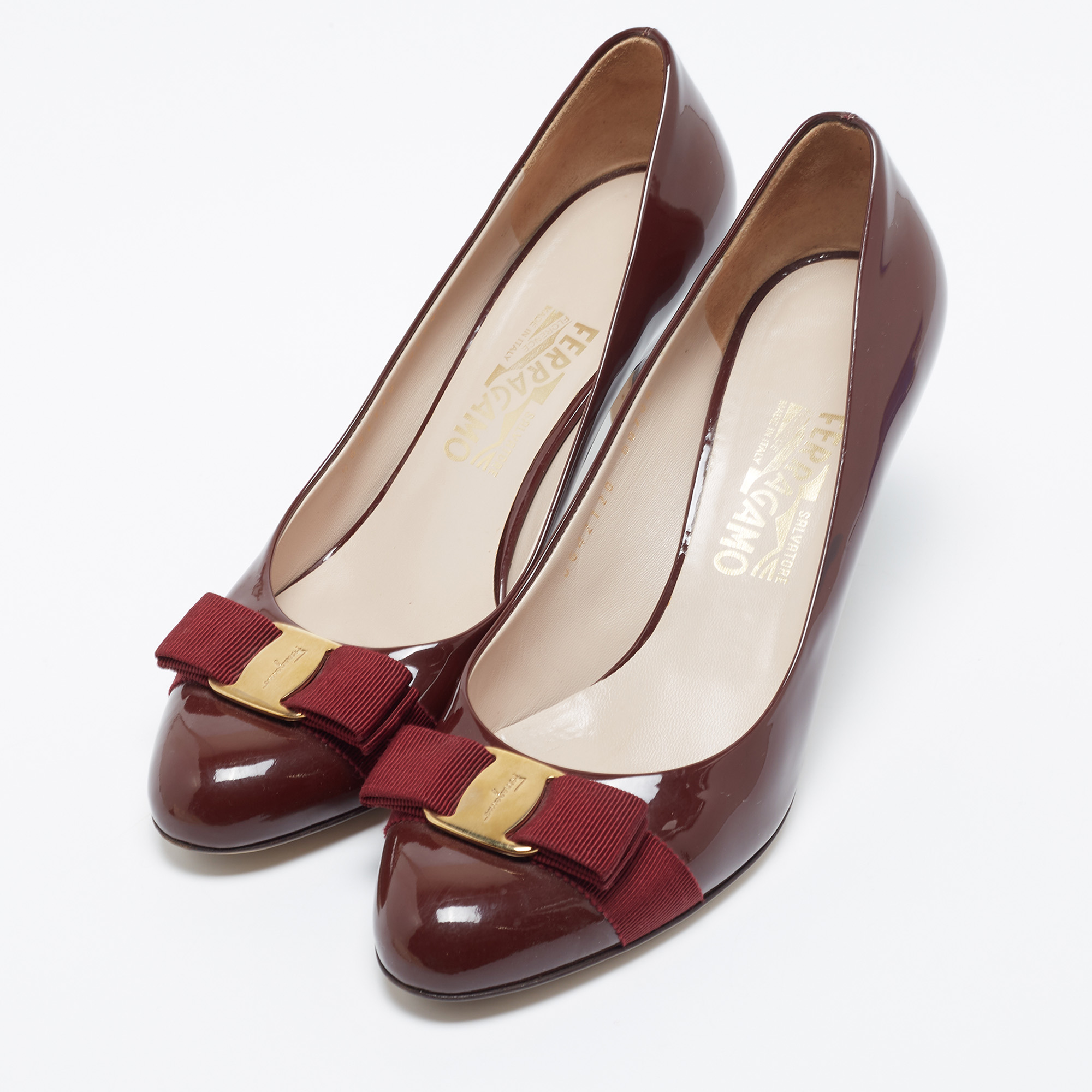 

Salvatore Ferragamo Burgundy Patent Leather Vara Bow Pumps Size