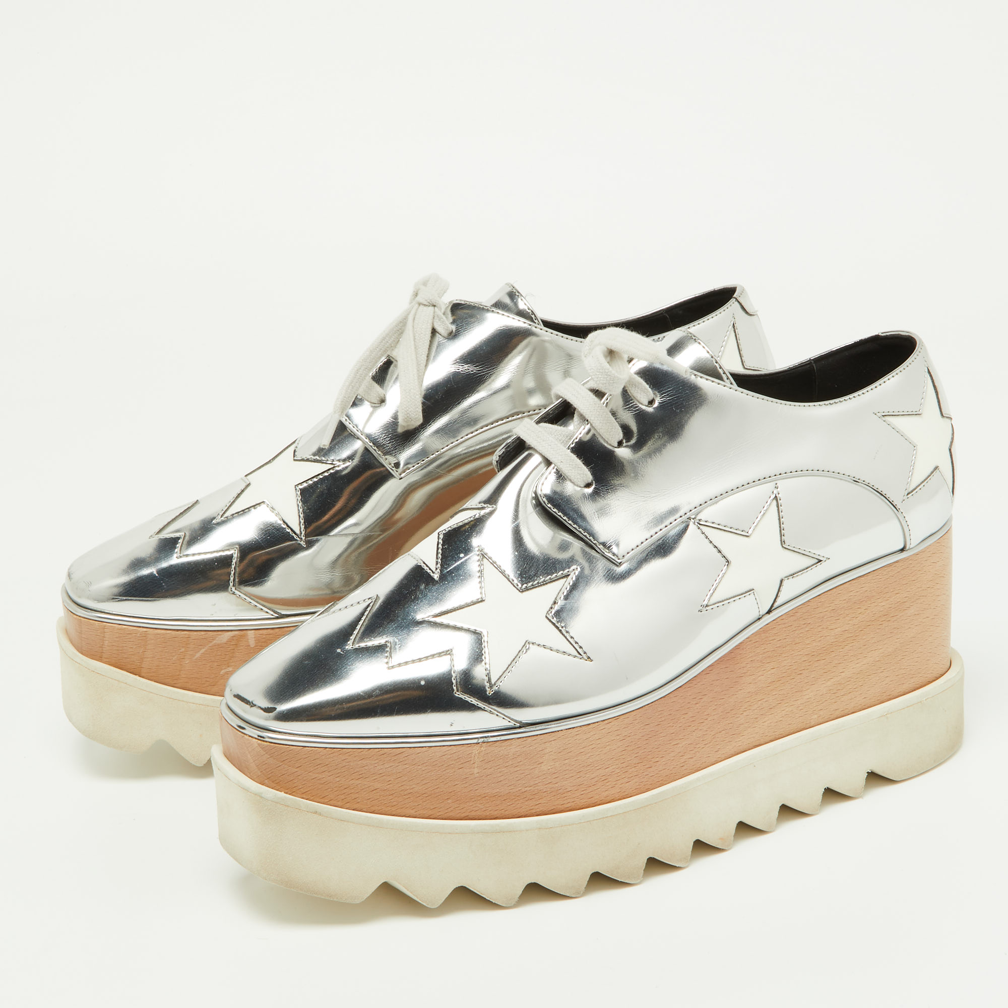 

Stella McCartney Silver/White Faux Patent And Faux Leather Elyse Star Platform Lace Up Sneakers Size