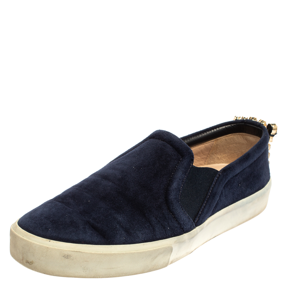 Ready to offer comfort and style this pair of sneakers by Stuart Weitzman will make a fantastic addition to your shoe collection. Theyve been crafted from blue suede and styled with crystal details on the counters. They are complete with white rubber soles.