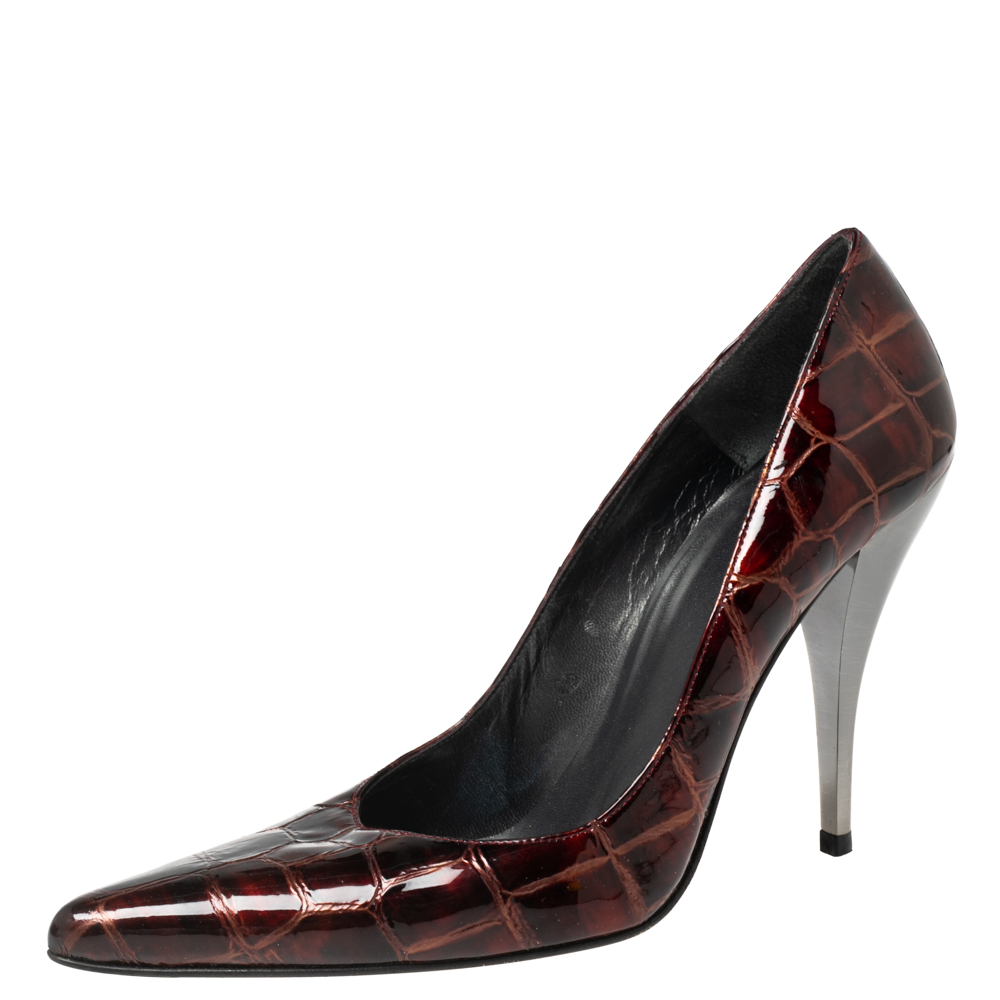 There are some shoes that stand the test of time and fashion cycles these timeless Stuart Weitzman pumps are the one. Crafted from croc embossed patent leather in a burgundy shade they are designed with sleek cuts pointed toes and tall heels.