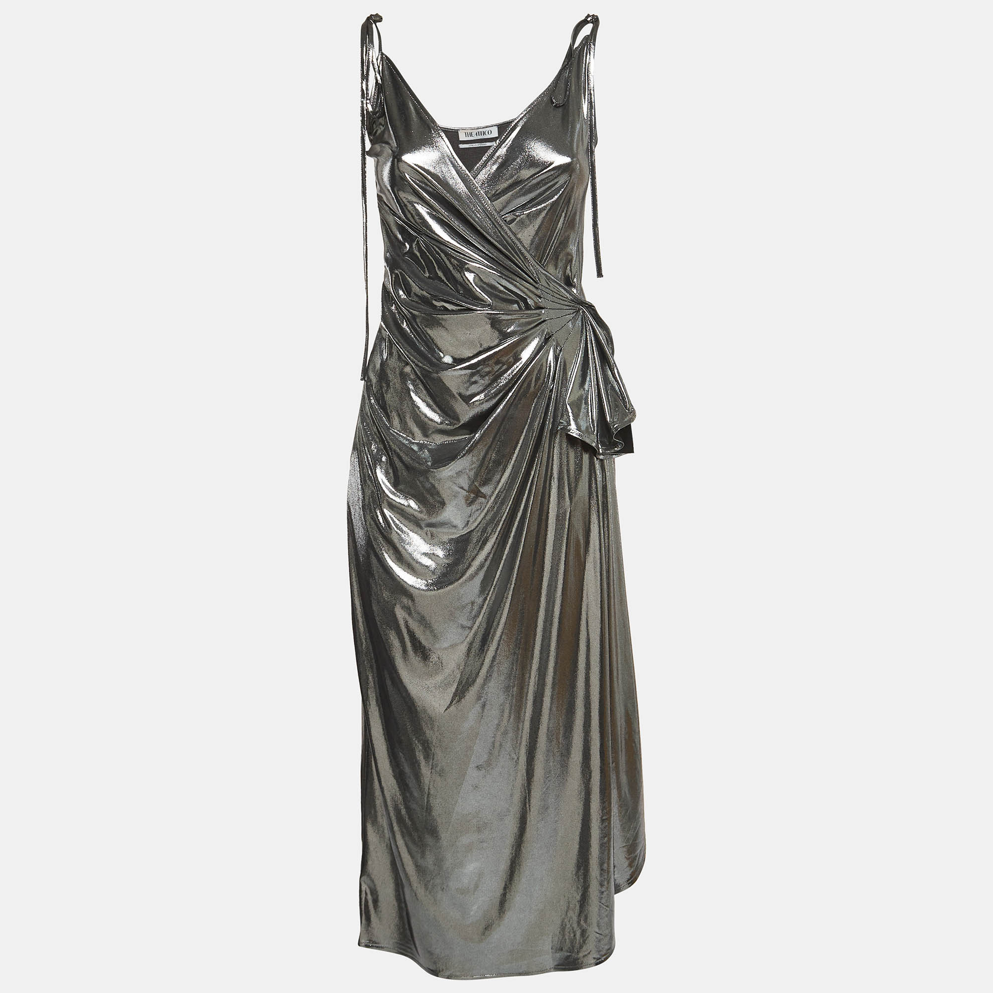 Dazzle in the Attico wrap dress a radiant ensemble that exudes elegance and glamour. Crafted with shimmering silver lamé fabric its figure flattering silhouette features delicate shoulder straps and a chic wrap design making it a captivating choice for any special occasion.