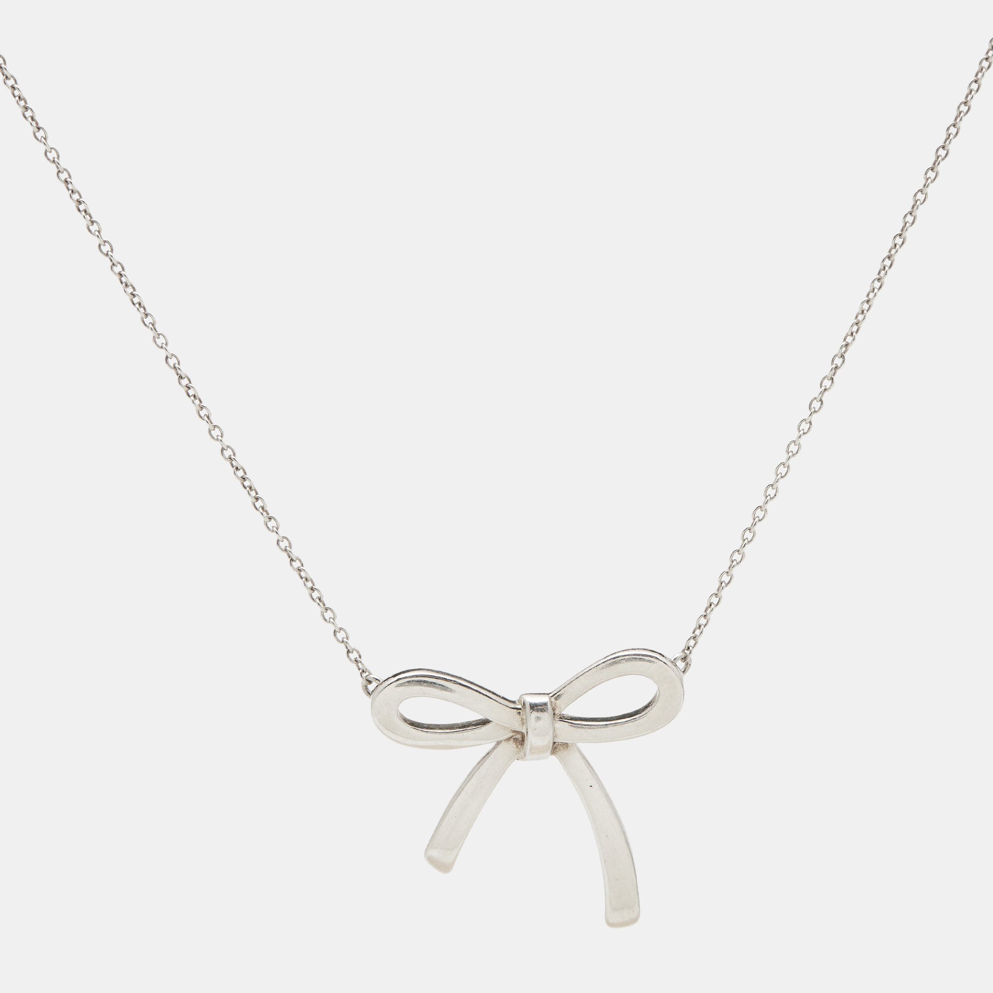 Tiffany & Co. Bow Sterling Silver Pendant Necklace And Earrings 