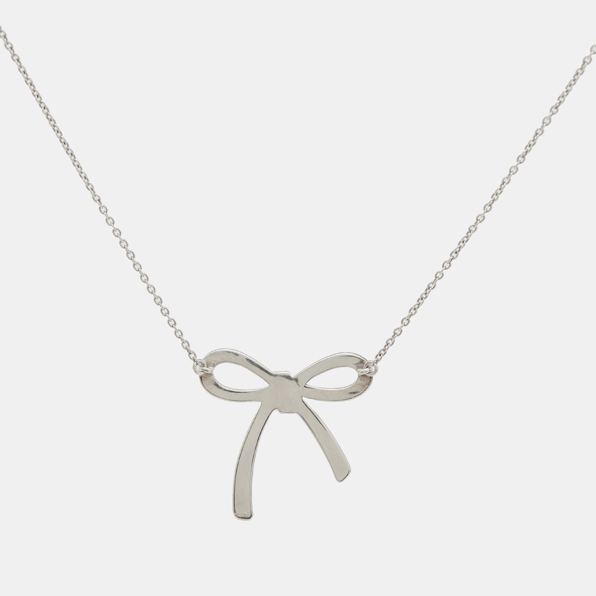 Tiffany & Co. Bow Sterling Silver Pendant Necklace And Earrings 