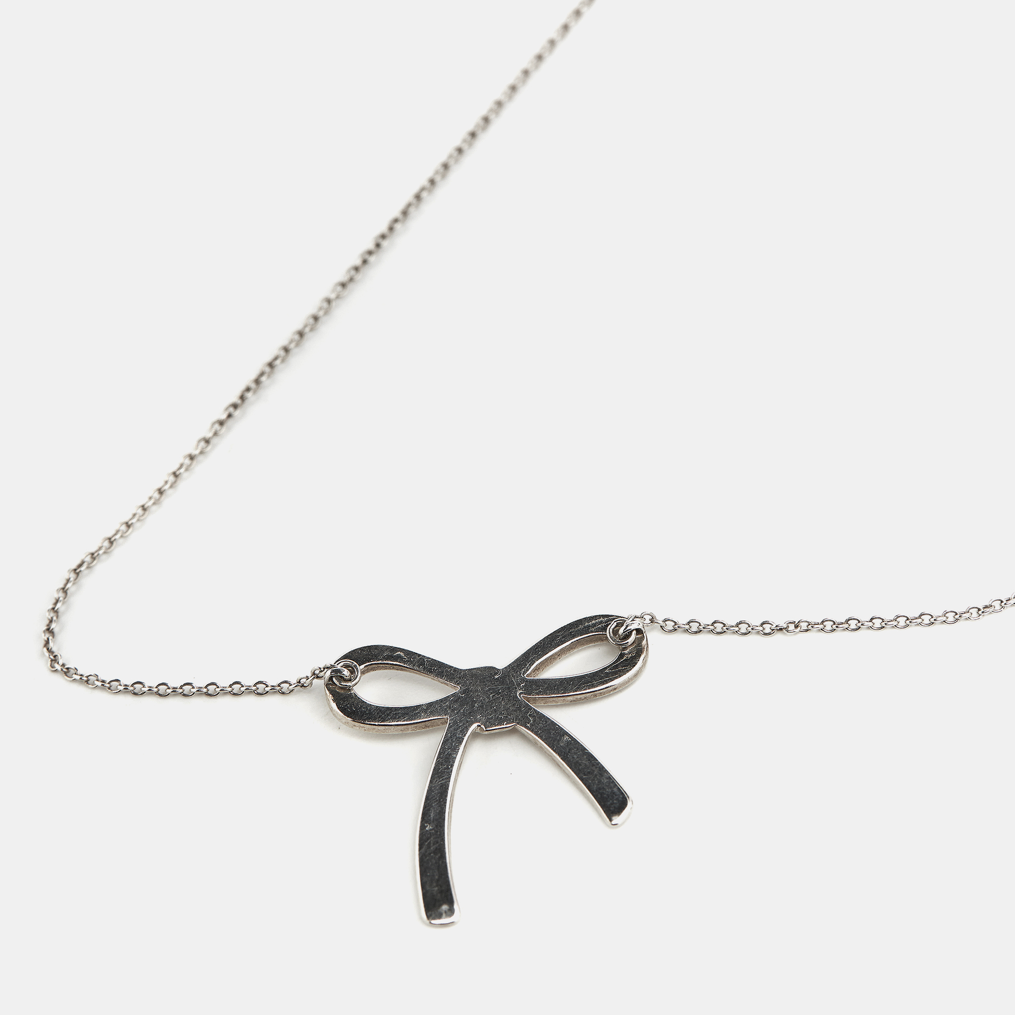 Tiffany & Co. Bow Sterling Silver Pendant Necklace And Earrings 
