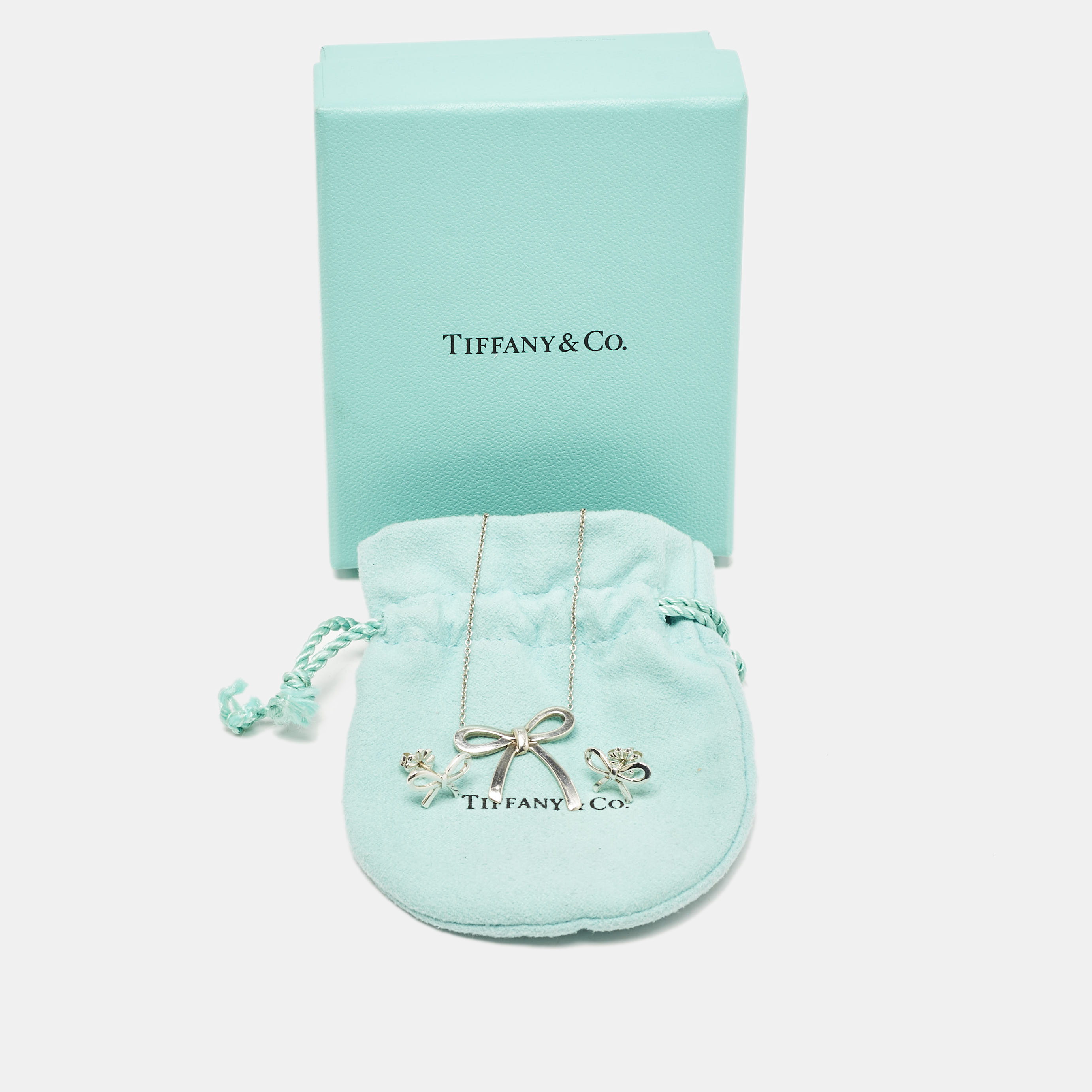 Tiffany & Co. Bow Sterling Silver Pendant Necklace And Earrings 