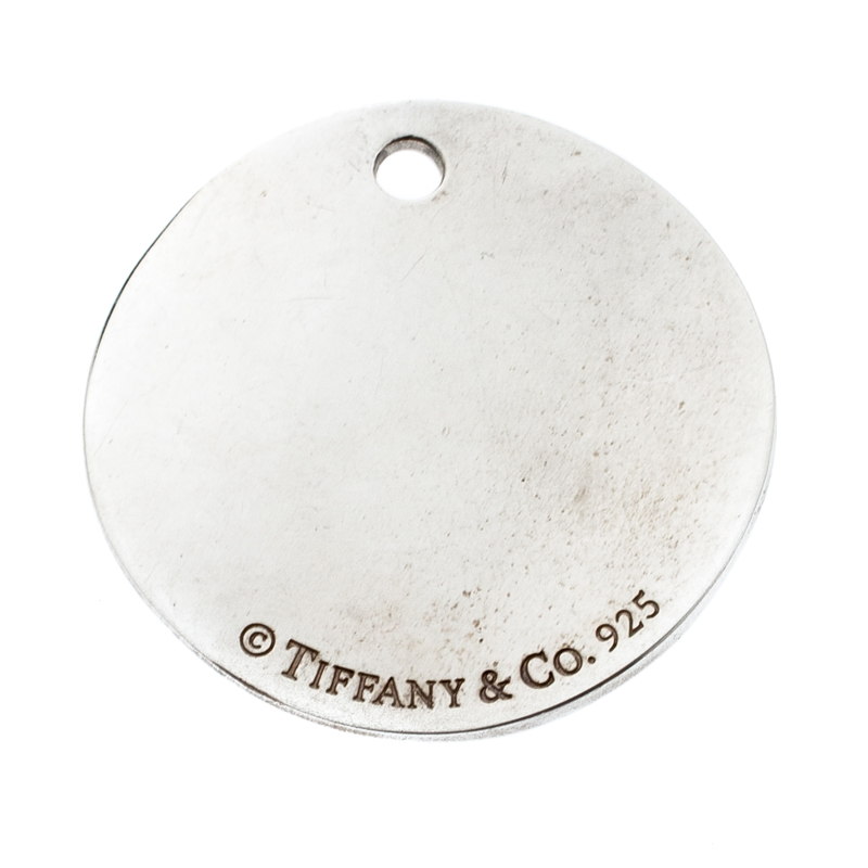 

Tiffany & Co. Tiffany Notes Fifth Avenue New York Engraved Circular Silver Pendant Charm