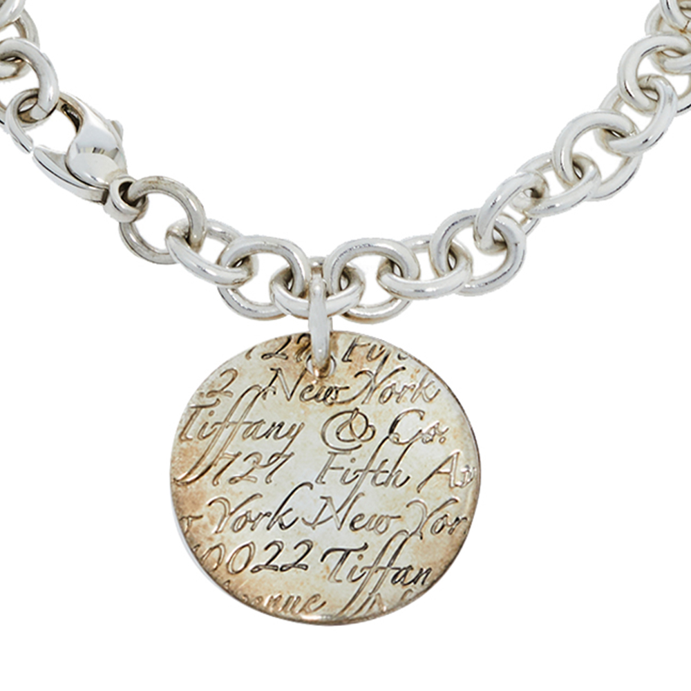 

Tiffany & Co. Notes Round Tag Charm Sterling Silver Bracelet