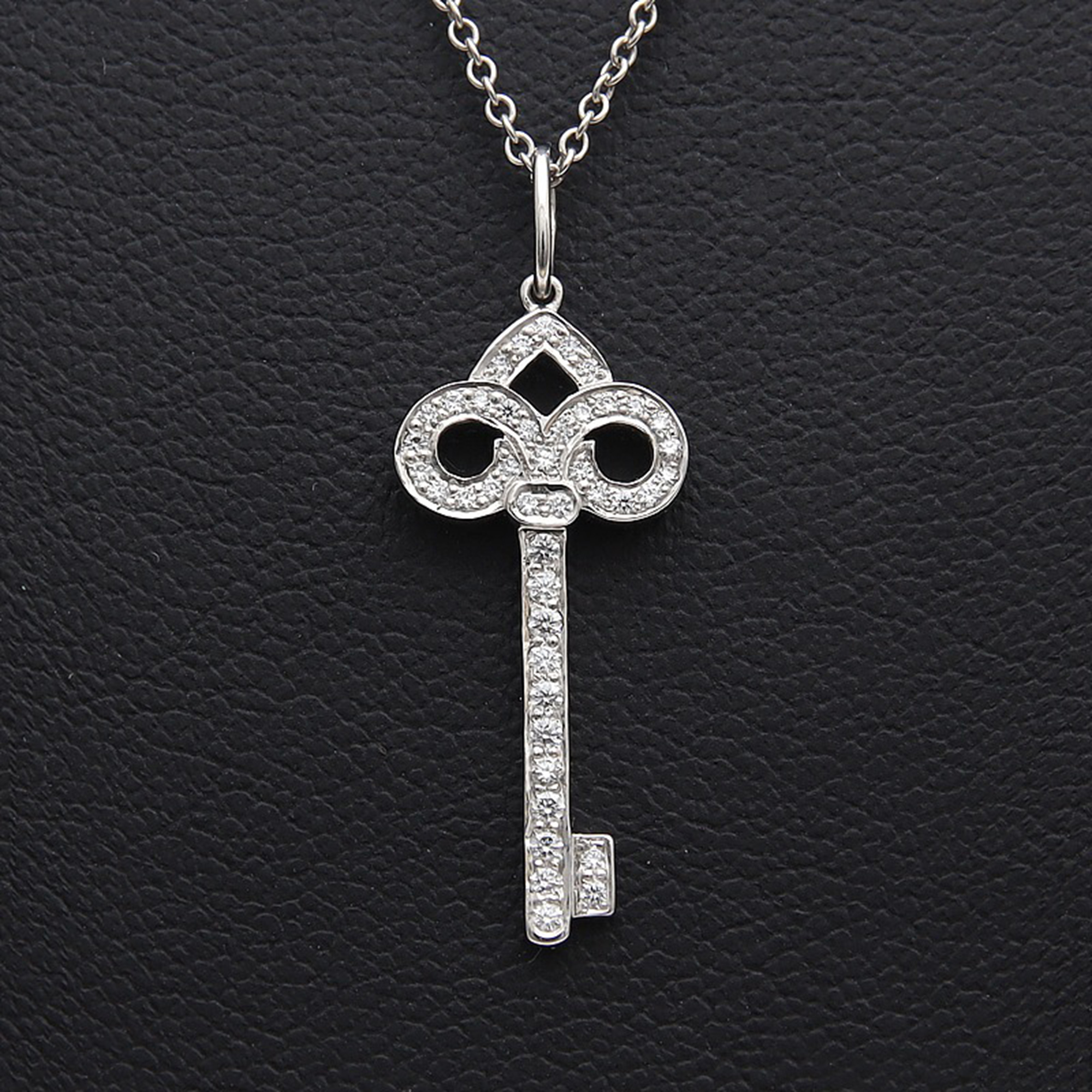 

Tiffany & Co. 18K White gold 0.44Ct Diamond Fleur de Lis Key Pendant Necklace