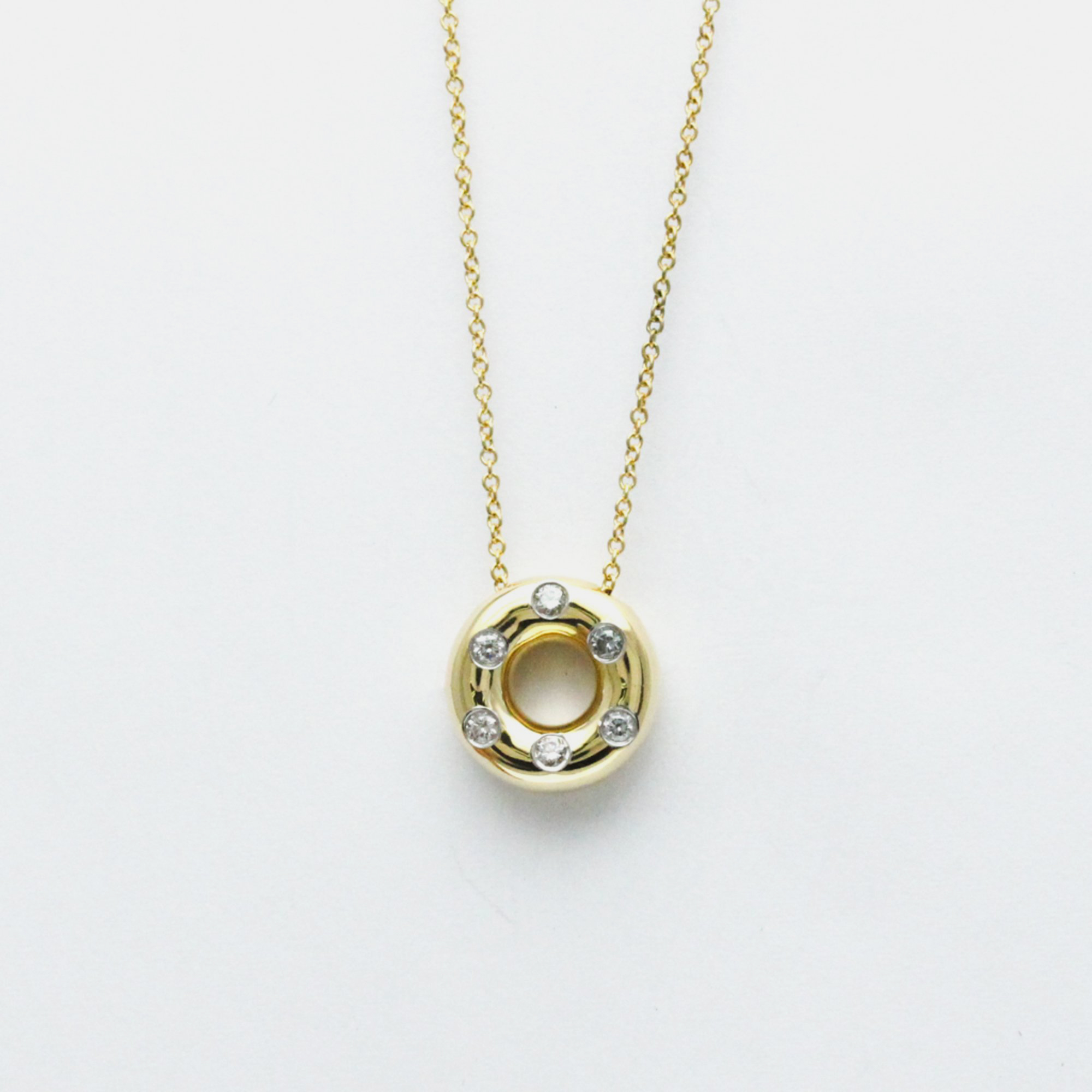 

Tiffany & Co. 18k Yellow Gold Etoile Diamond Circle Pendant Necklace
