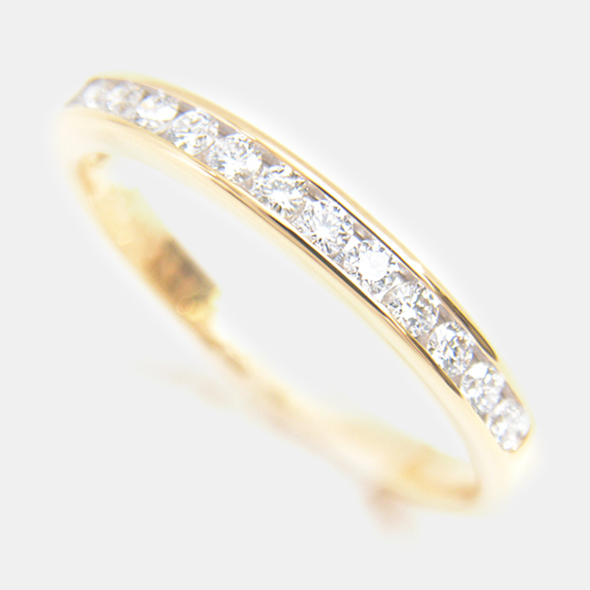 

Tiffany & Co. 18K Yellow Gold and Diamond Half Eternity Channel Set Band Ring EU 49