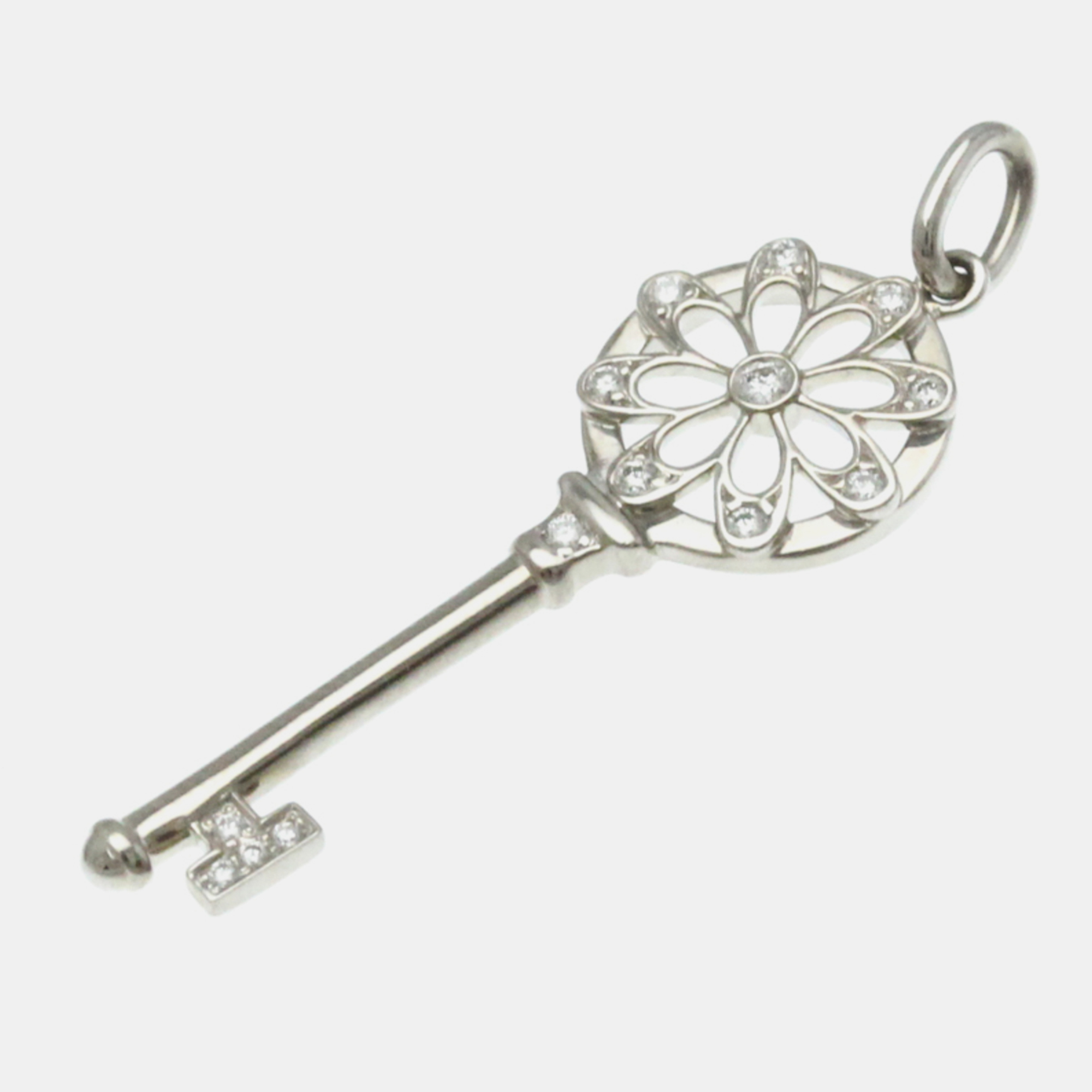 

Tiffany & Co. 18K White Gold and Diamond Floral Key Pendant Charm